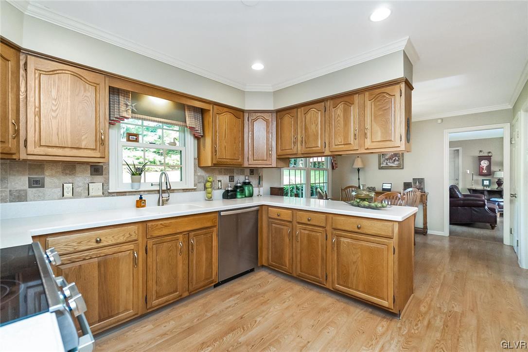 2285 Woodbarn Road Lower Macungie Township, PA 18062 - Photo 8 of 45 a kitchen with a sink window and cabinets