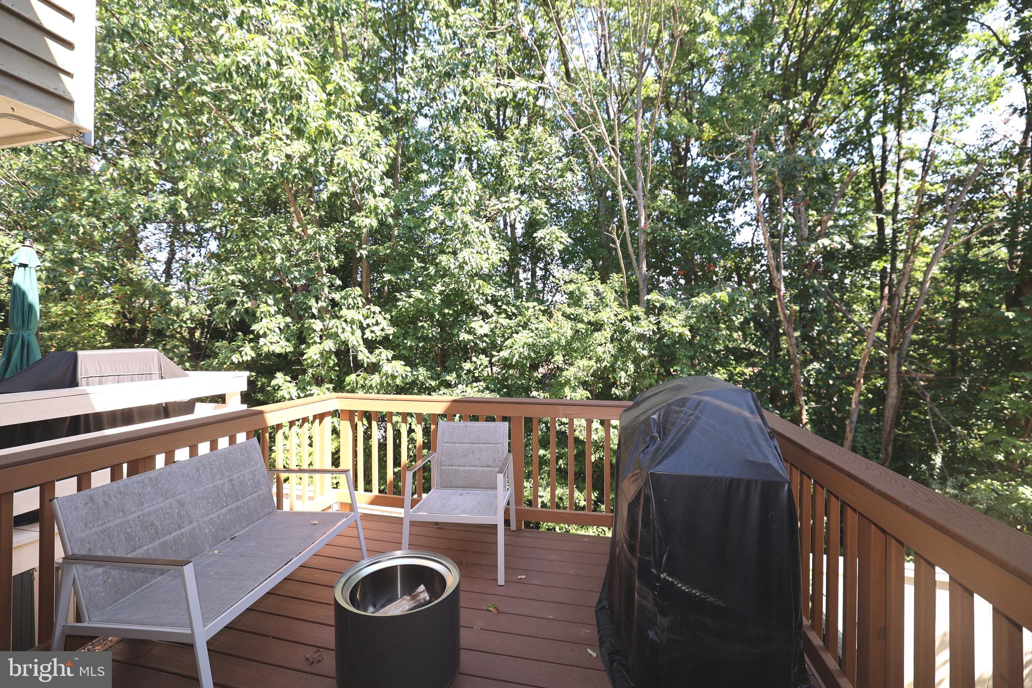 1939 Belmont Ridge Court Reston, VA 20191 - Photo 6 of 14 a balcony with wooden floor table and chairs