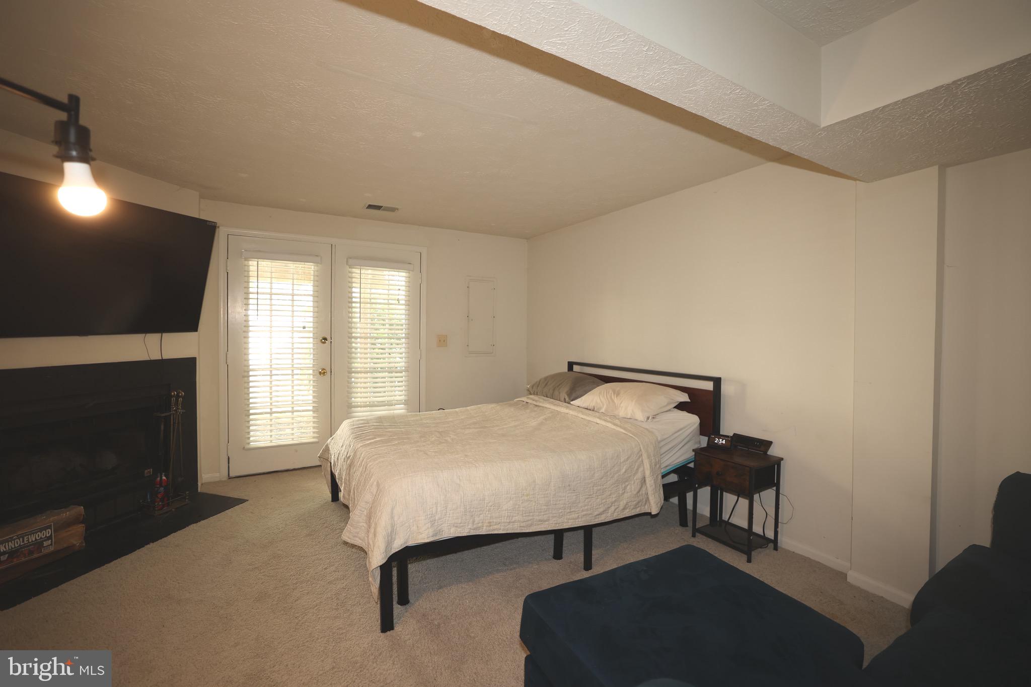 1939 Belmont Ridge Court Reston, VA 20191 - Photo 7 of 14 a bedroom with a bed and a flat screen tv