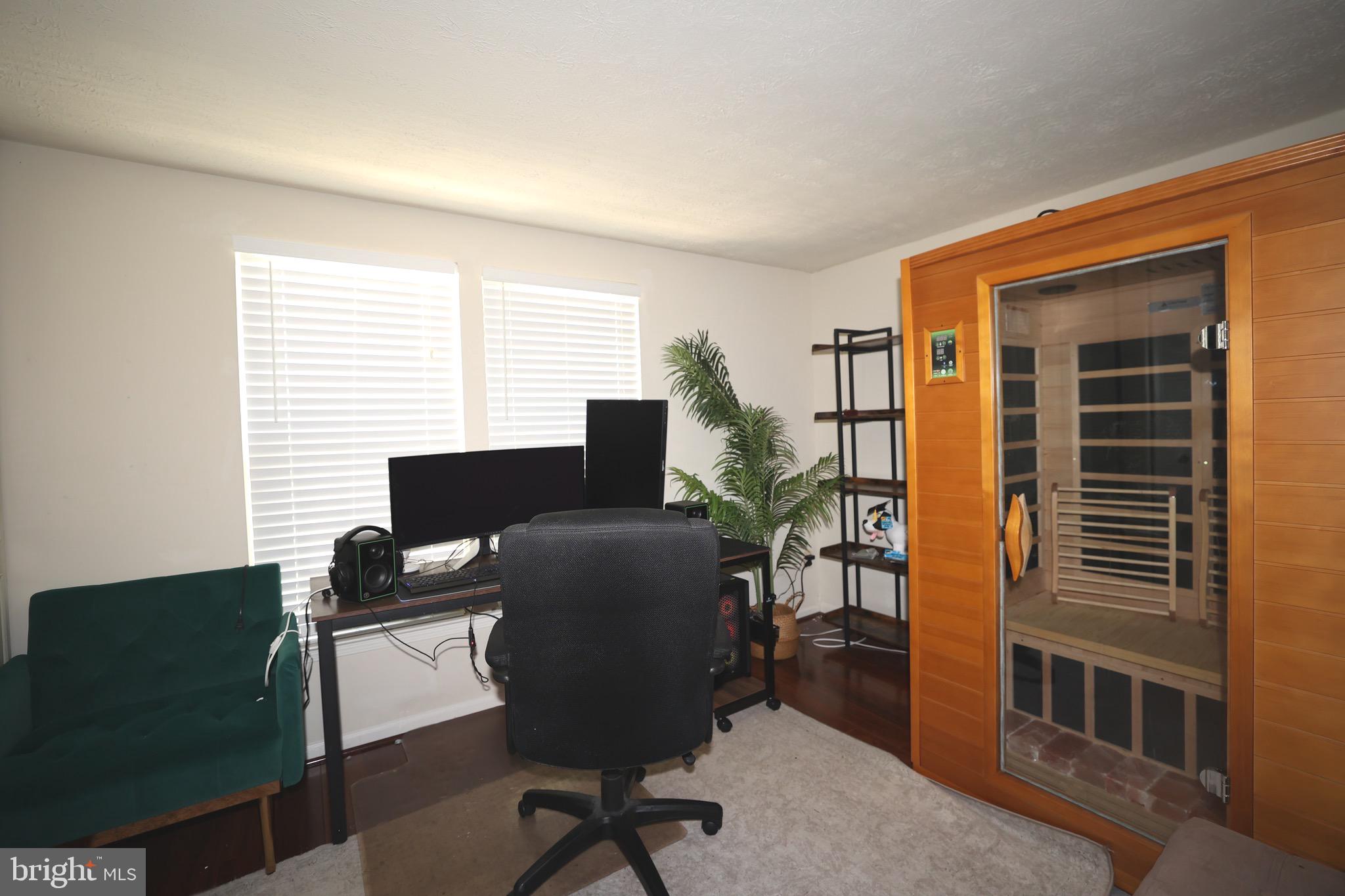 1939 Belmont Ridge Court Reston, VA 20191 - Photo 9 of 14 a view of a workspace with furniture and a window