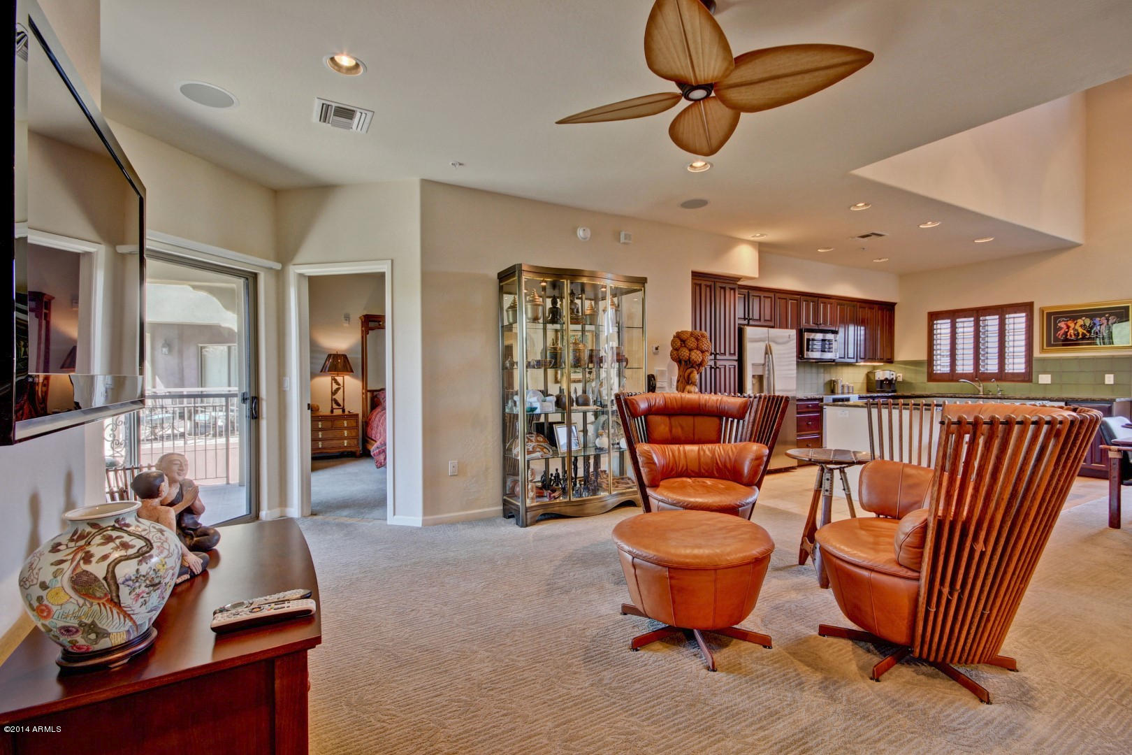 3935 East Rough Rider Road, Unit 1089 Phoenix, AZ 85050 - Photo 1 of 71 a living room with furniture a rug and a chandelier