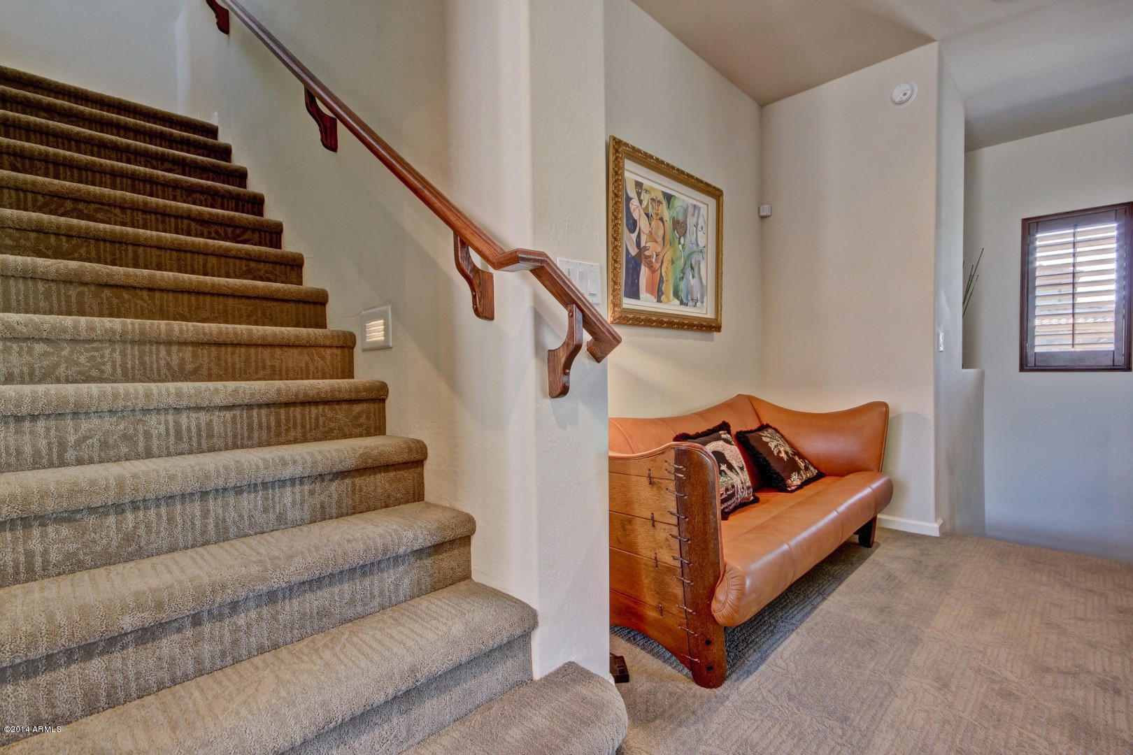 3935 East Rough Rider Road, Unit 1089 Phoenix, AZ 85050 - Photo 11 of 71 a living room with furniture and stairs