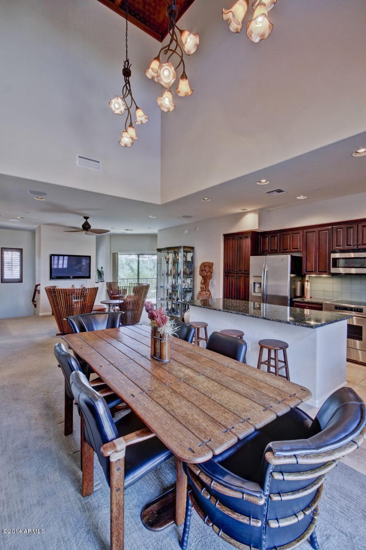 3935 East Rough Rider Road, Unit 1089 Phoenix, AZ 85050 - Photo 21 of 71 a view of a dining room with furniture