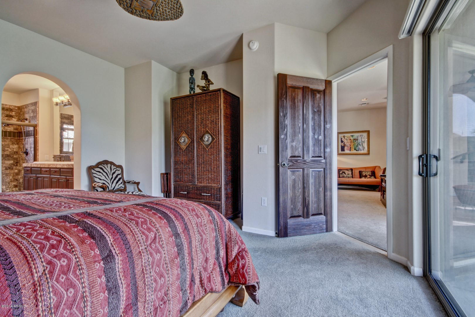 3935 East Rough Rider Road, Unit 1089 Phoenix, AZ 85050 - Photo 24 of 71 a bedroom with a bed and a mirror