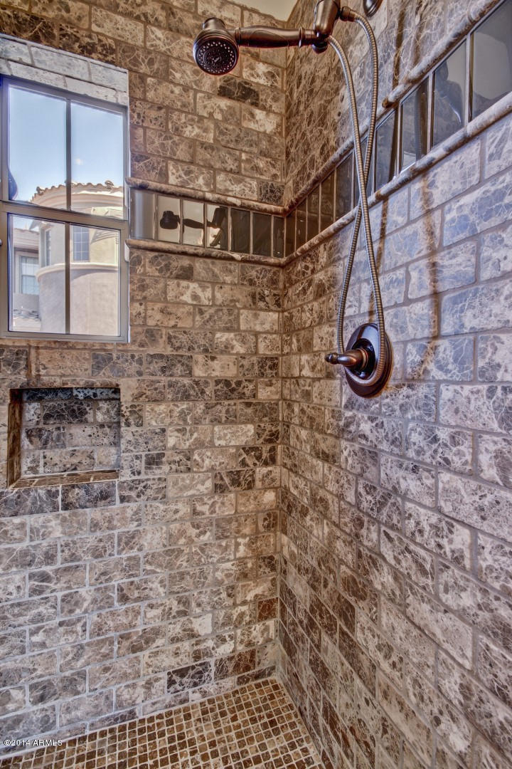 3935 East Rough Rider Road, Unit 1089 Phoenix, AZ 85050 - Photo 28 of 71 a bathroom with a shower