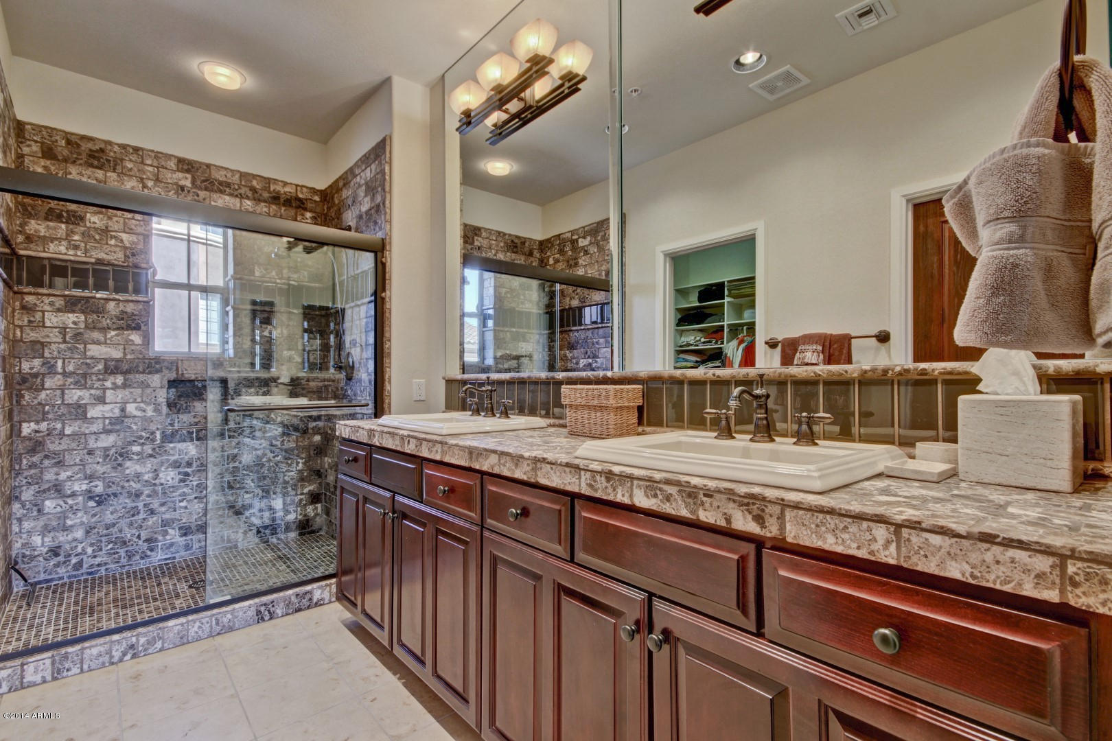 3935 East Rough Rider Road, Unit 1089 Phoenix, AZ 85050 - Photo 3 of 71 a bathroom with sink and mirror