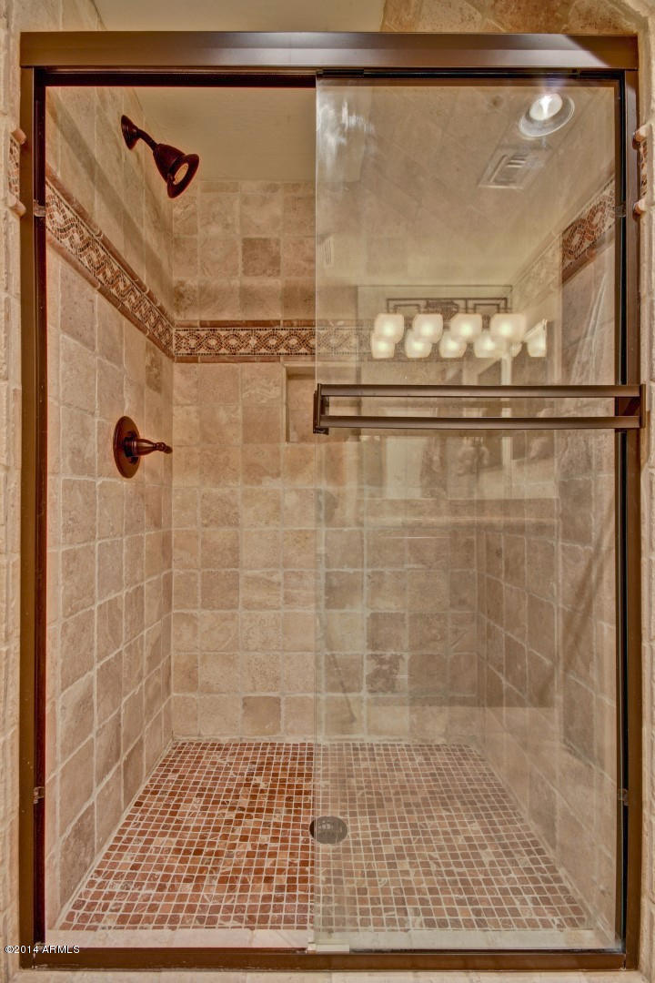 3935 East Rough Rider Road, Unit 1089 Phoenix, AZ 85050 - Photo 32 of 71 a bathroom with a shower