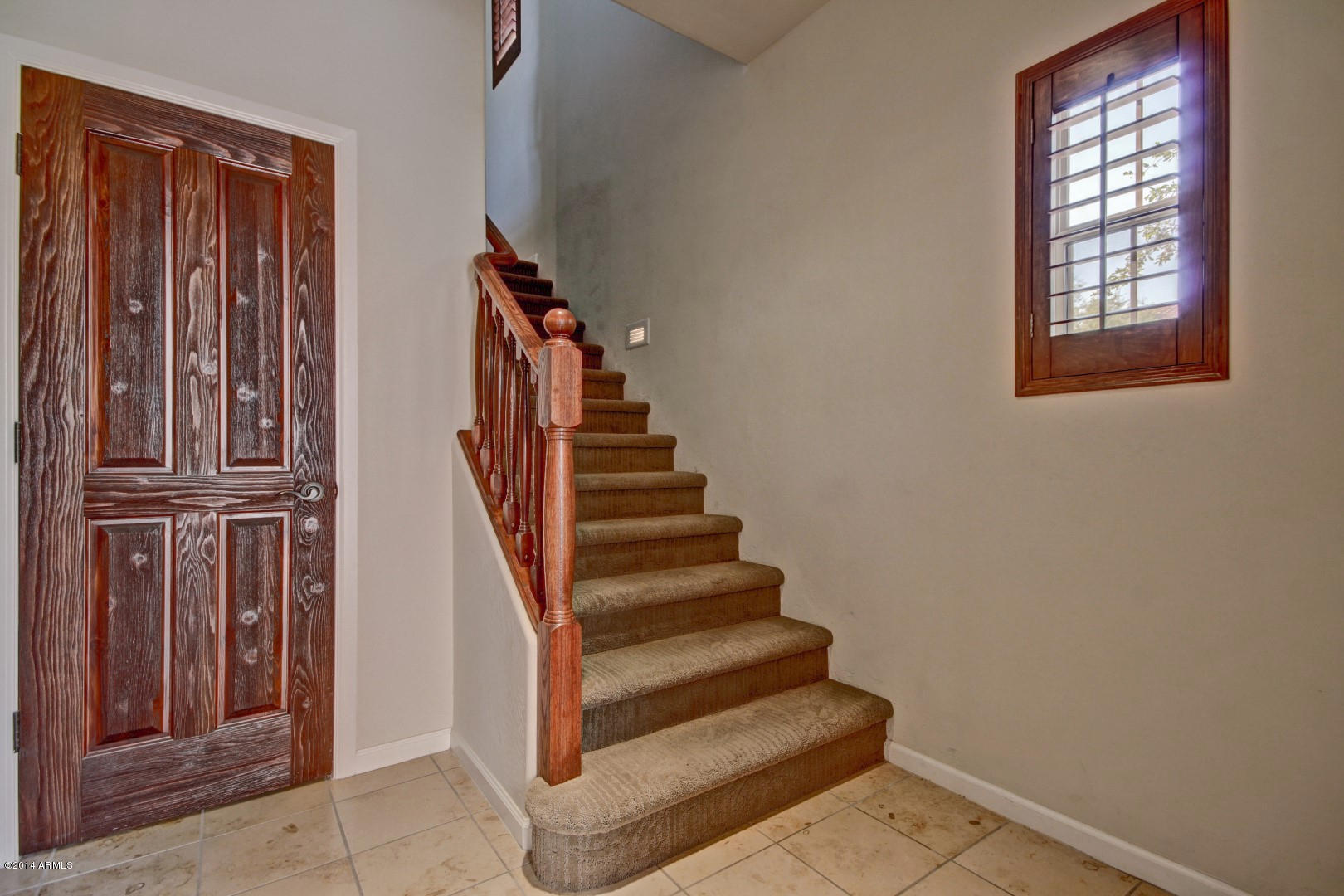 3935 East Rough Rider Road, Unit 1089 Phoenix, AZ 85050 - Photo 40 of 71 a view of entryway with wooden floor and stairs