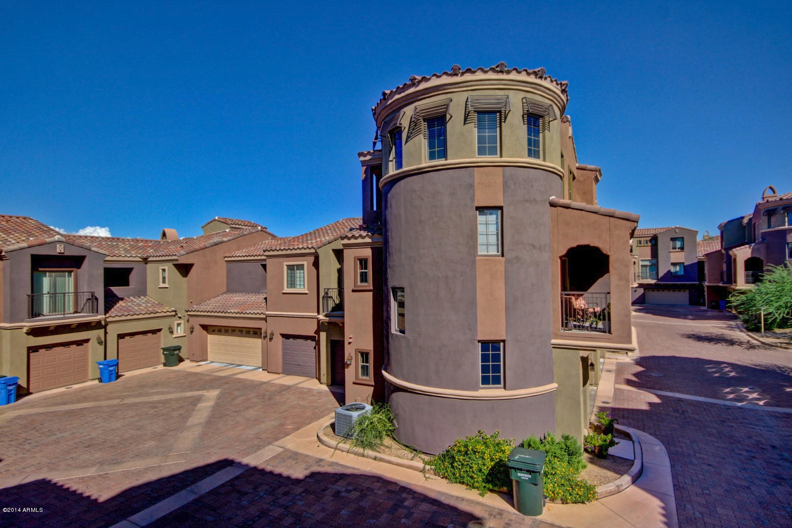 3935 East Rough Rider Road, Unit 1089 Phoenix, AZ 85050 - Photo 46 of 71 a front view of a house with a yard