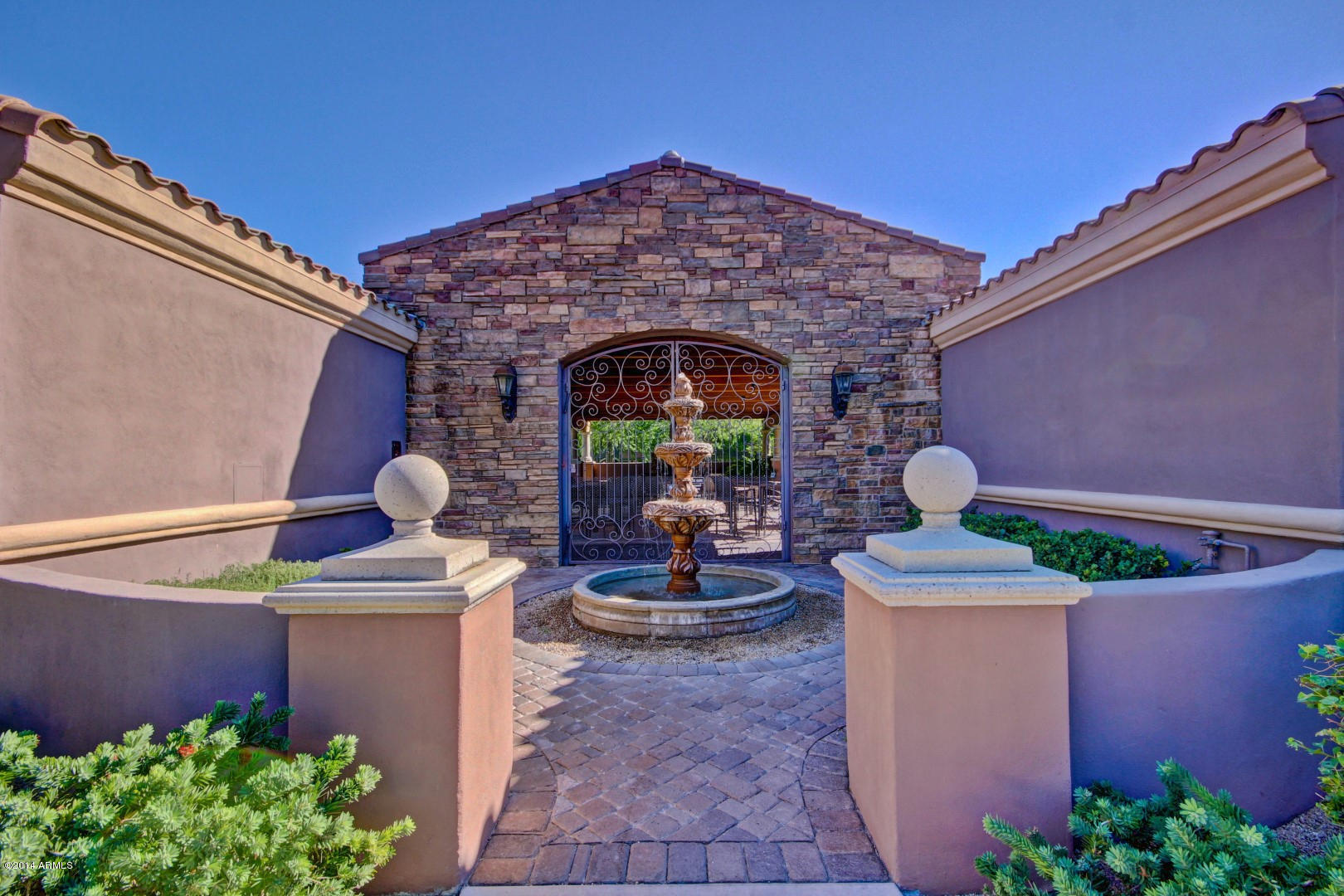 3935 East Rough Rider Road, Unit 1089 Phoenix, AZ 85050 - Photo 51 of 71 a view of a patio with table and chairs potted plants