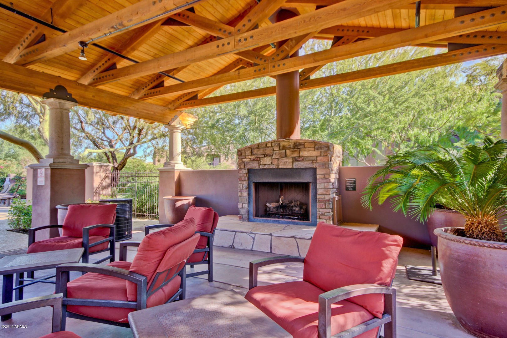 3935 East Rough Rider Road, Unit 1089 Phoenix, AZ 85050 - Photo 54 of 71 a outdoor space with patio the couches and a fireplace