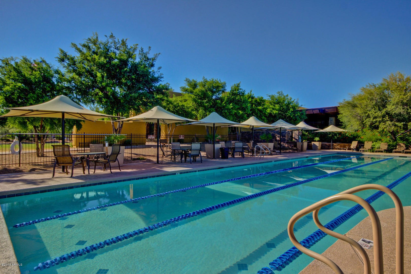 3935 East Rough Rider Road, Unit 1089 Phoenix, AZ 85050 - Photo 60 of 71 a swimming pool with outdoor seating and yard