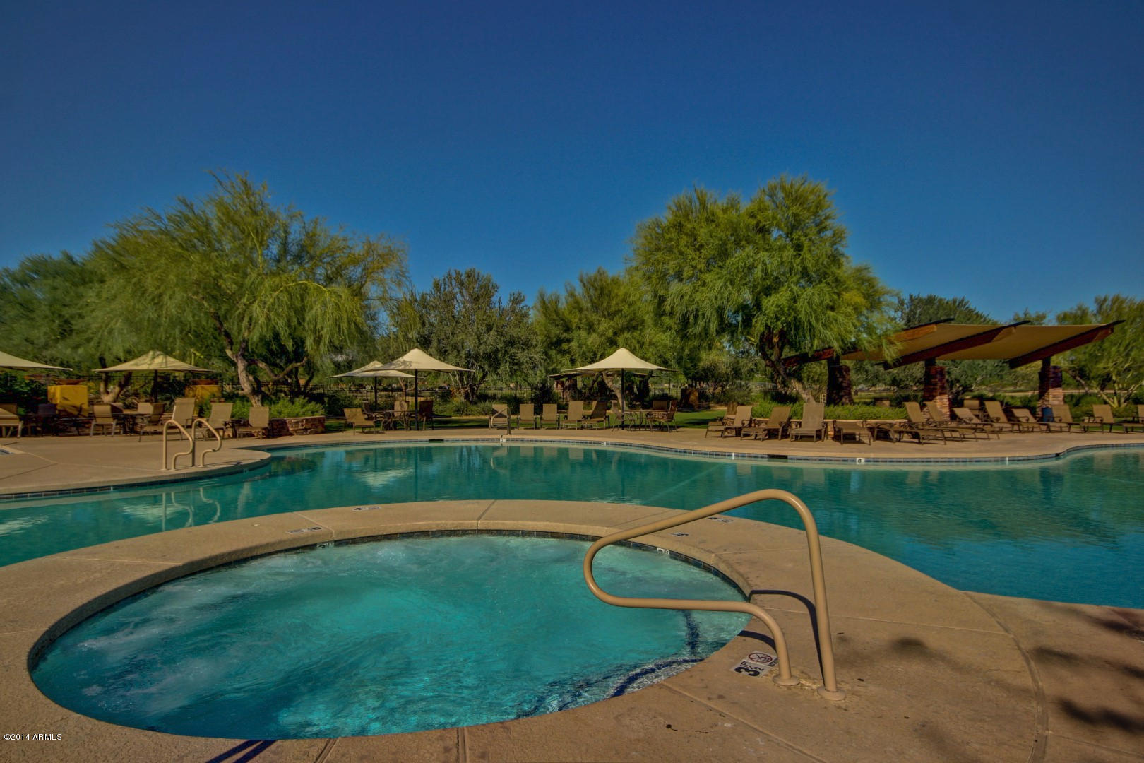 3935 East Rough Rider Road, Unit 1089 Phoenix, AZ 85050 - Photo 64 of 71 a view of a swimming pool in a yard