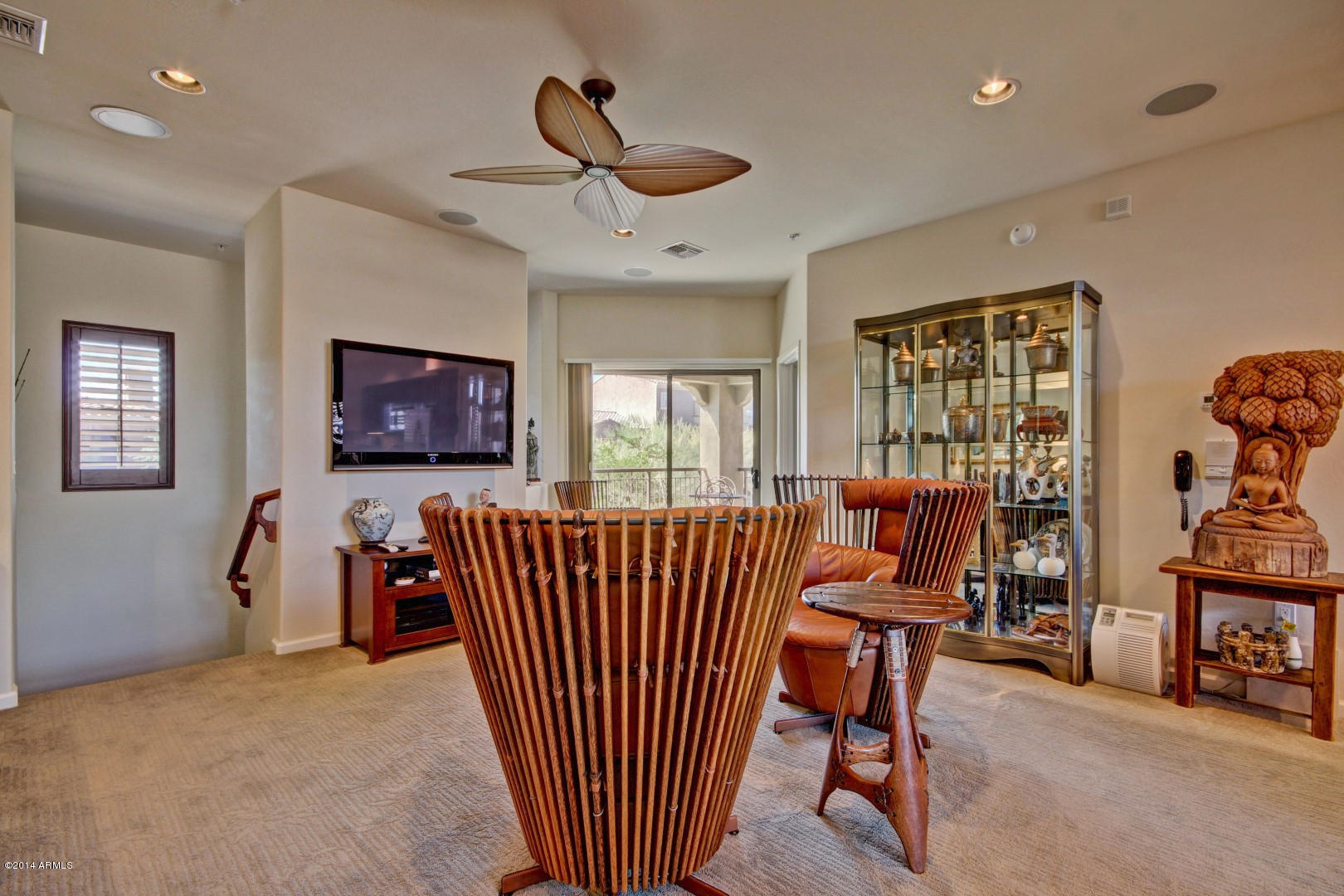 3935 East Rough Rider Road, Unit 1089 Phoenix, AZ 85050 - Photo 7 of 71 a living room with furniture floor to ceiling window and a flat screen tv