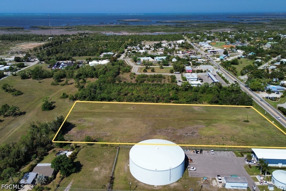 5361 Pine Island Road Bokeelia, FL 33922 - Photo 2 of 10 an aerial view of a house with a swimming pool