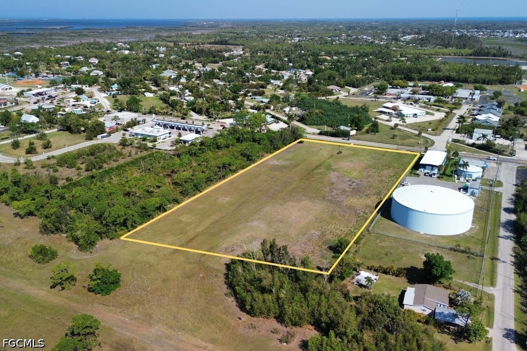 5361 Pine Island Road Bokeelia, FL 33922 - Photo 4 of 10 an aerial view of a house with a swimming pool