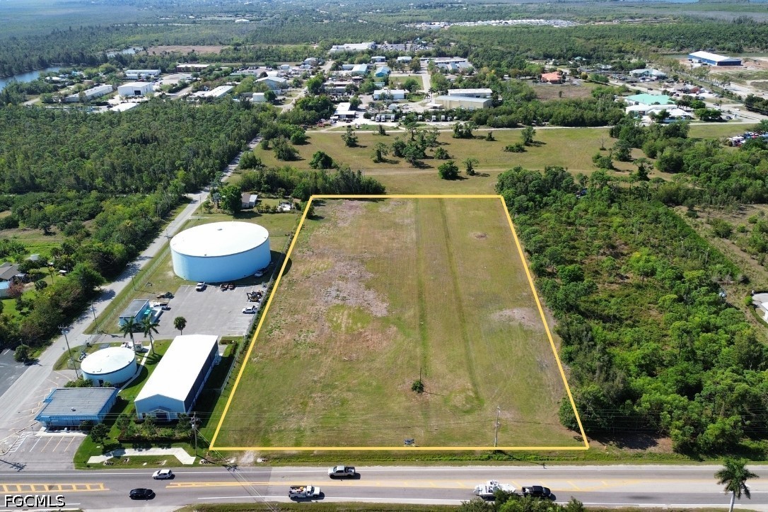 5361 Pine Island Road Bokeelia, FL 33922 - Photo 8 of 10 an aerial view of residential houses with outdoor space