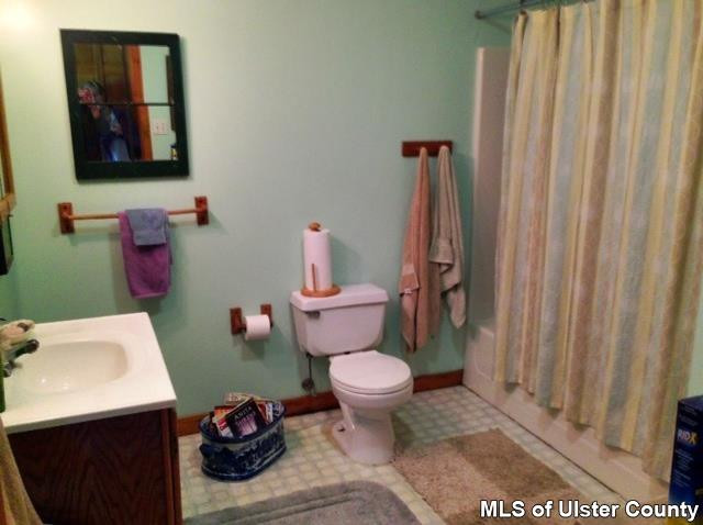 219 Cherry Hill Road Accord, NY 12404 - Photo 12 of 15 a bathroom with a toilet and a sink