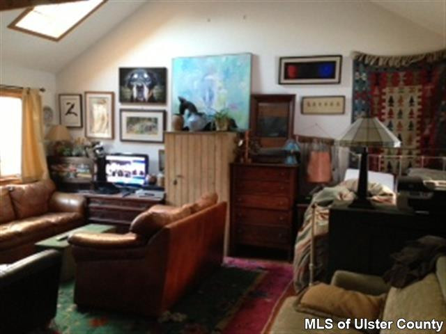 219 Cherry Hill Road Accord, NY 12404 - Photo 14 of 15 a living room with furniture and a flat screen tv