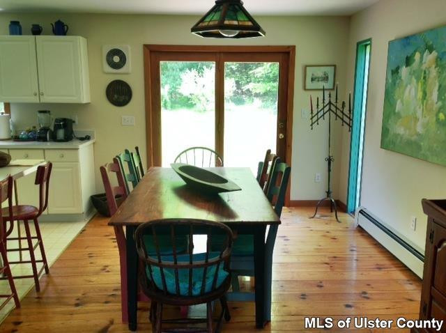 219 Cherry Hill Road Accord, NY 12404 - Photo 9 of 15 a view of a dining room with furniture window and wooden floor