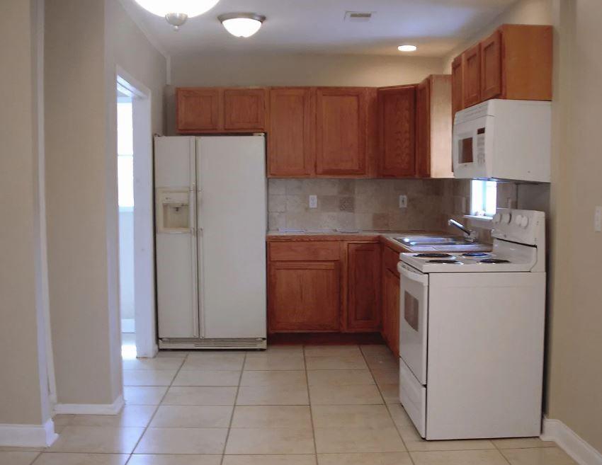 1972 Don Juan Lane Decatur, GA 30032 - Photo 2 of 6 a kitchen with a sink a stove and a refrigerator