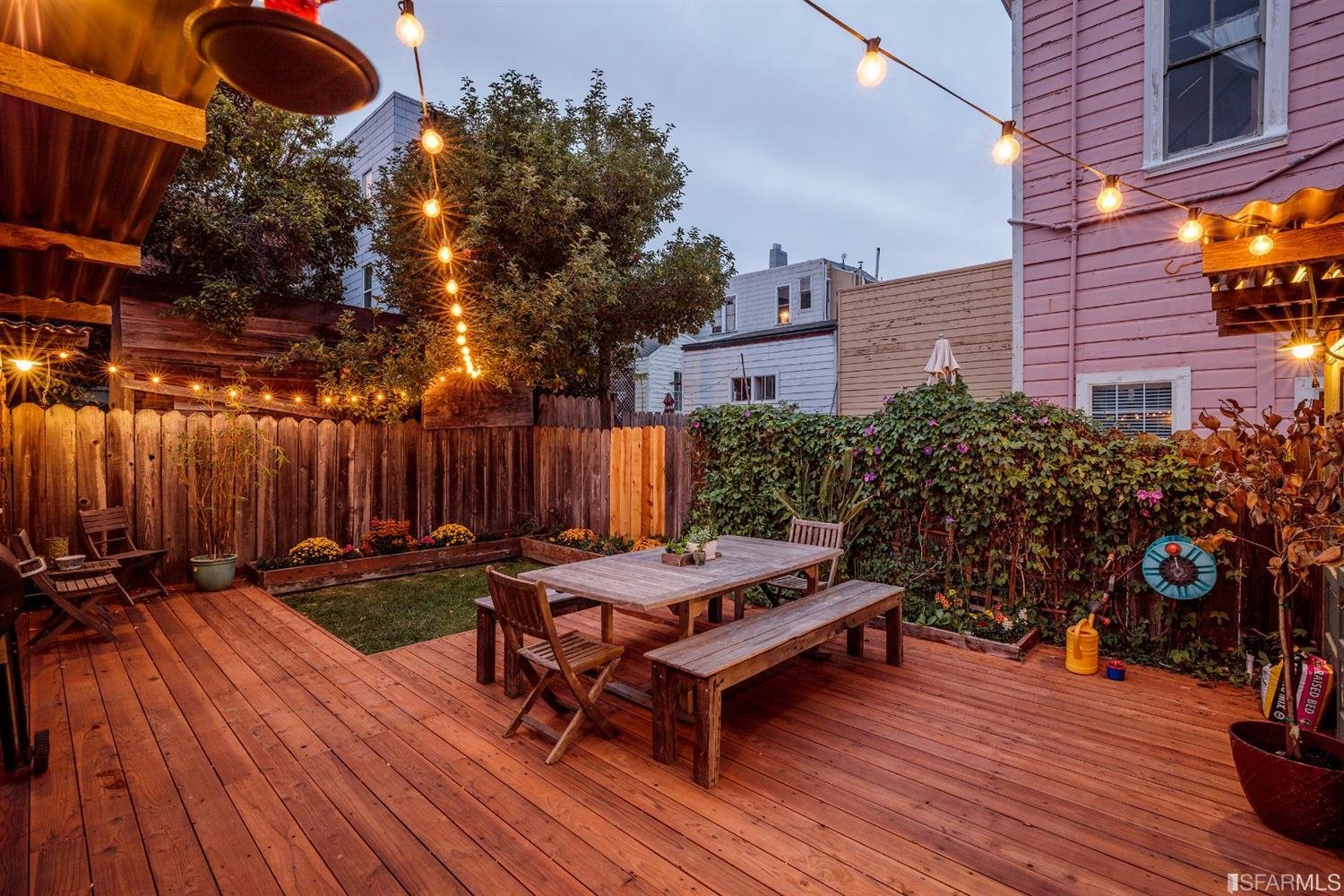 a view of a backyard with sitting area and wooden floor