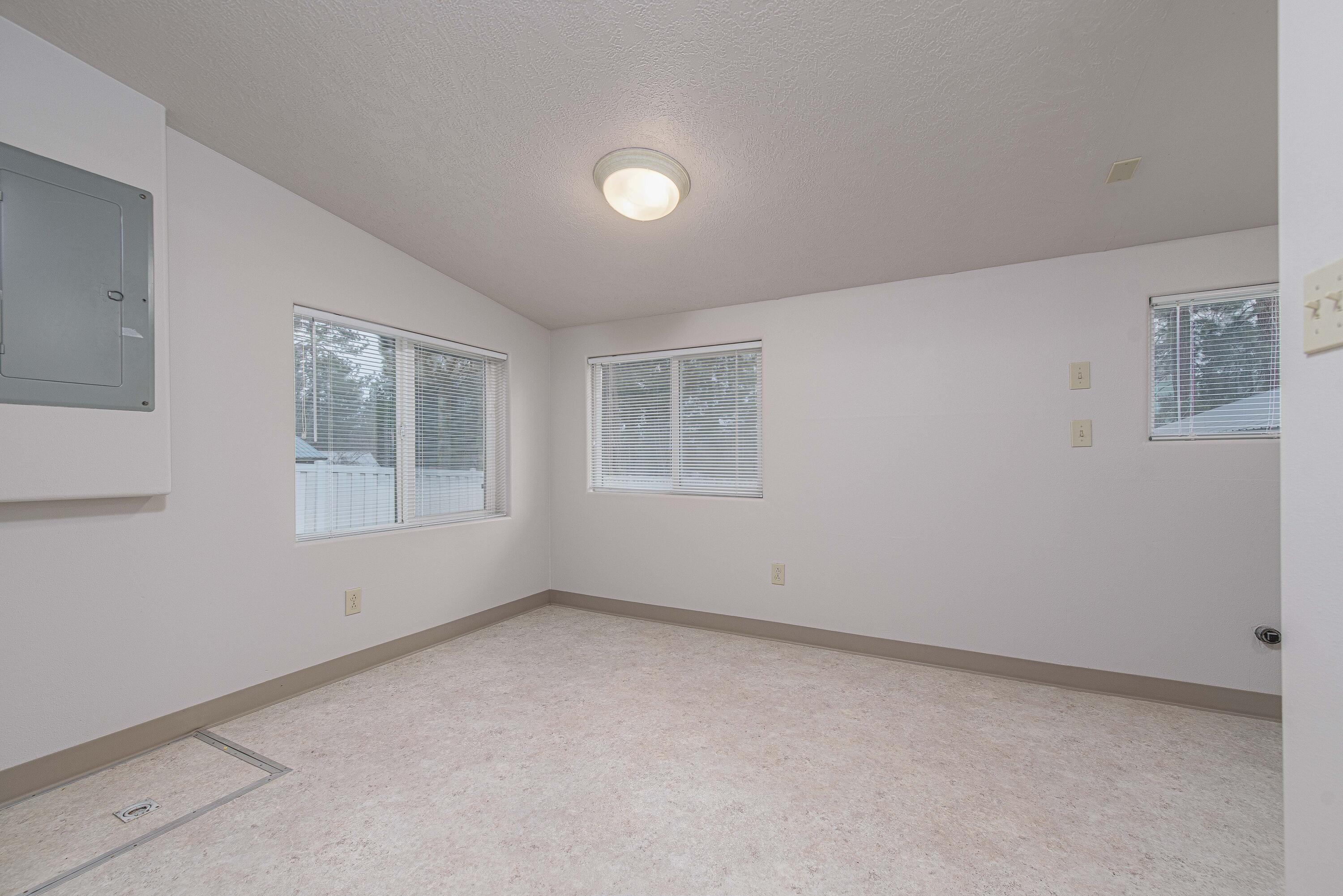 138722 Rhododendron Street Gilchrist, OR 97737 - Photo 19 of 36 a view of empty room with windows