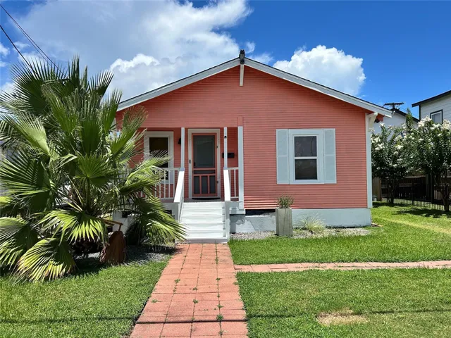 a front view of house and yard with green space