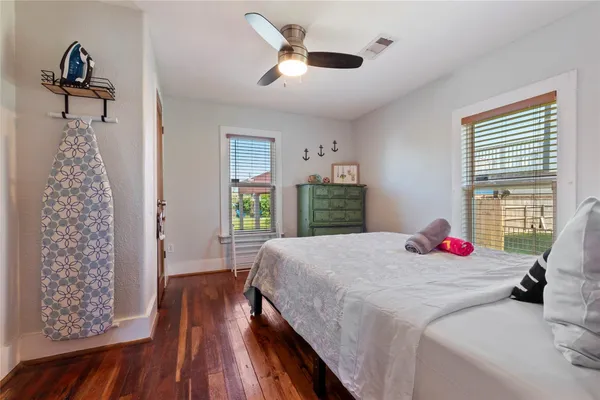 a bedroom with bed and a window
