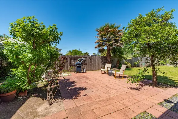 a view of a backyard with sitting area