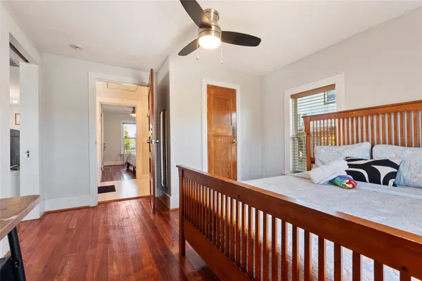 a view of a room with wooden floor and windows