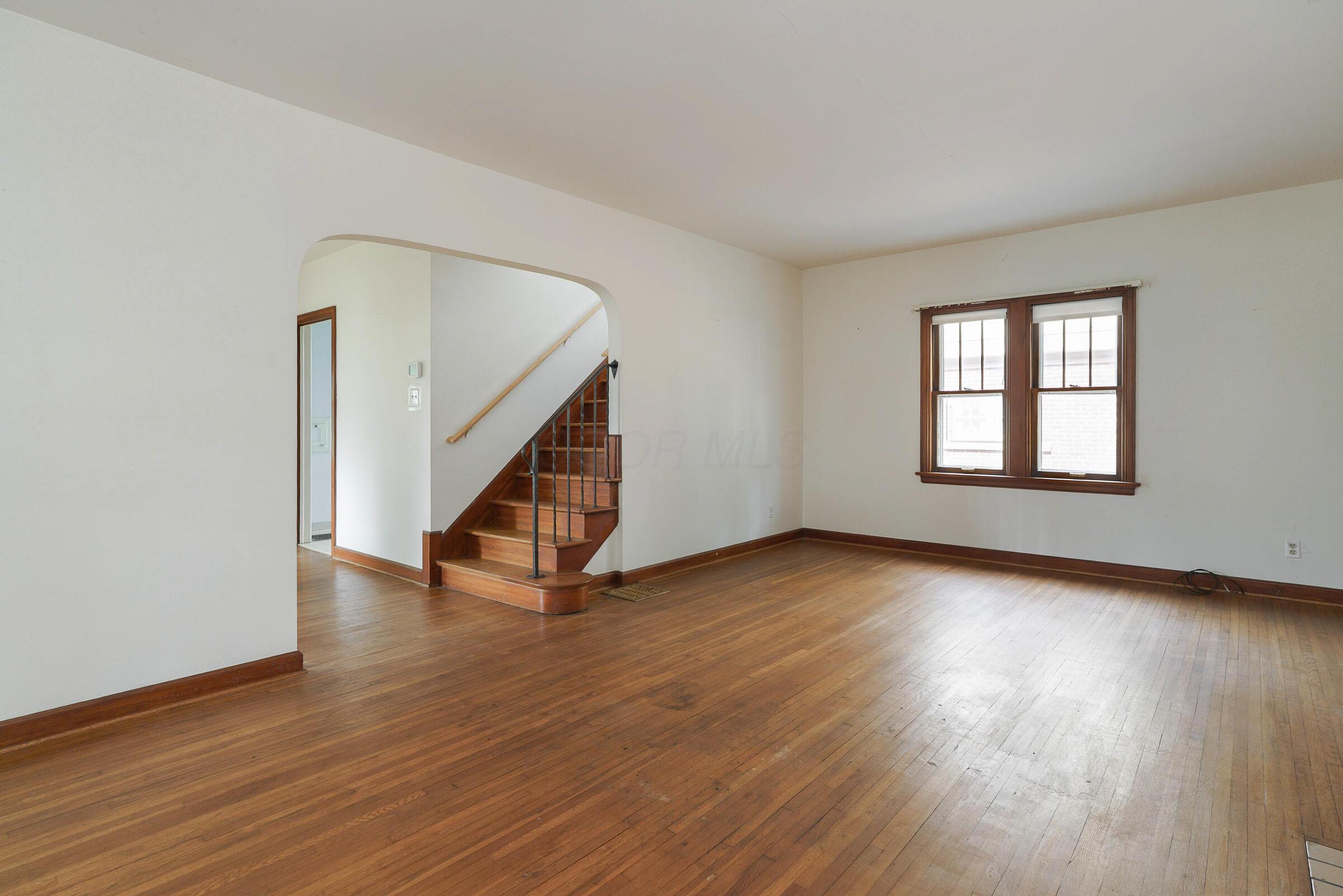 117 Chatham Road Columbus, OH 43214 - Photo 9 of 37 Archways, wrought iron handrail and impressive wood floors are found throughout the home.