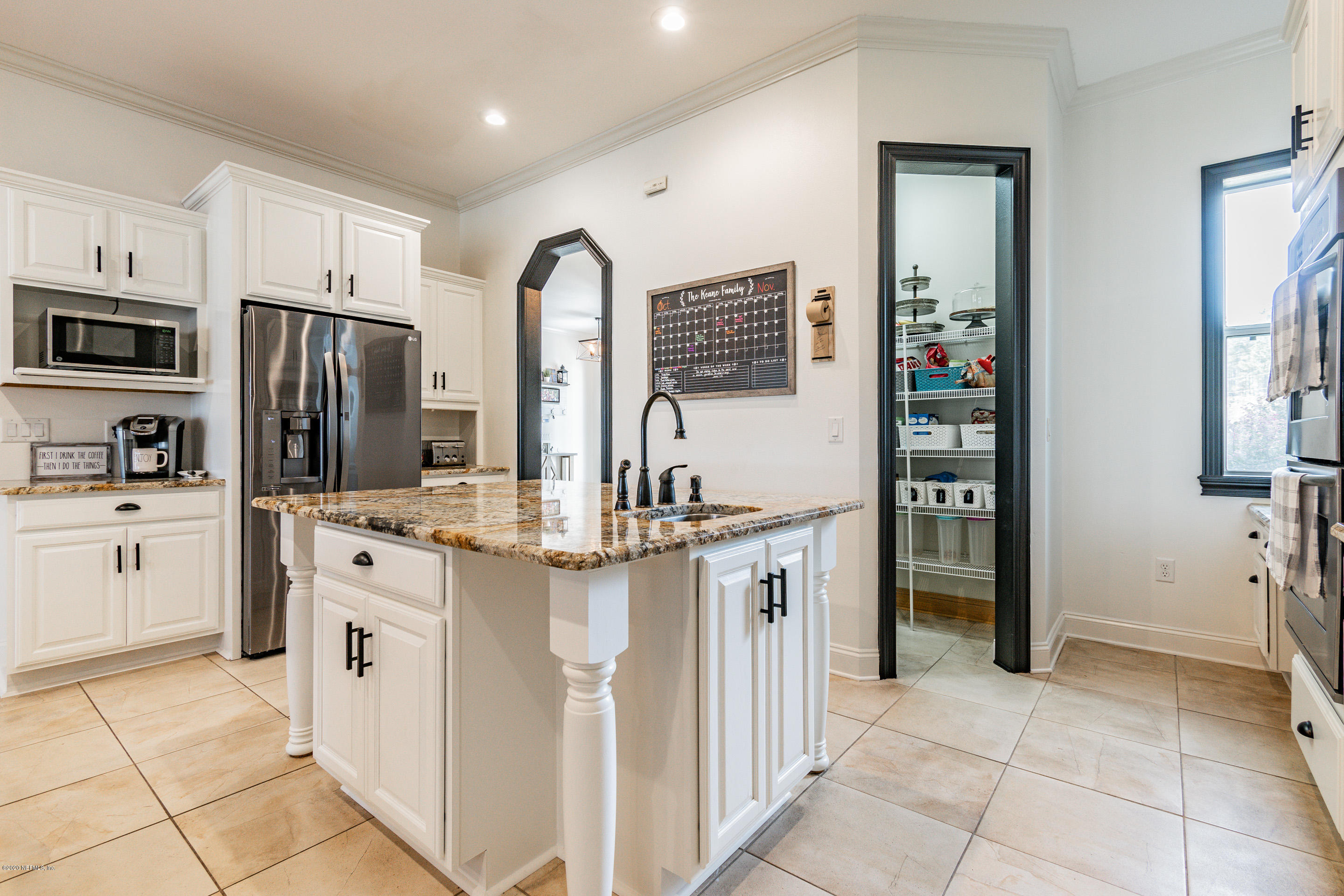 14689 Diamond Ranch Drive Jacksonville, FL 32234 - Photo 16 of 76 a kitchen with stainless steel appliances granite countertop a refrigerator and a stove top oven