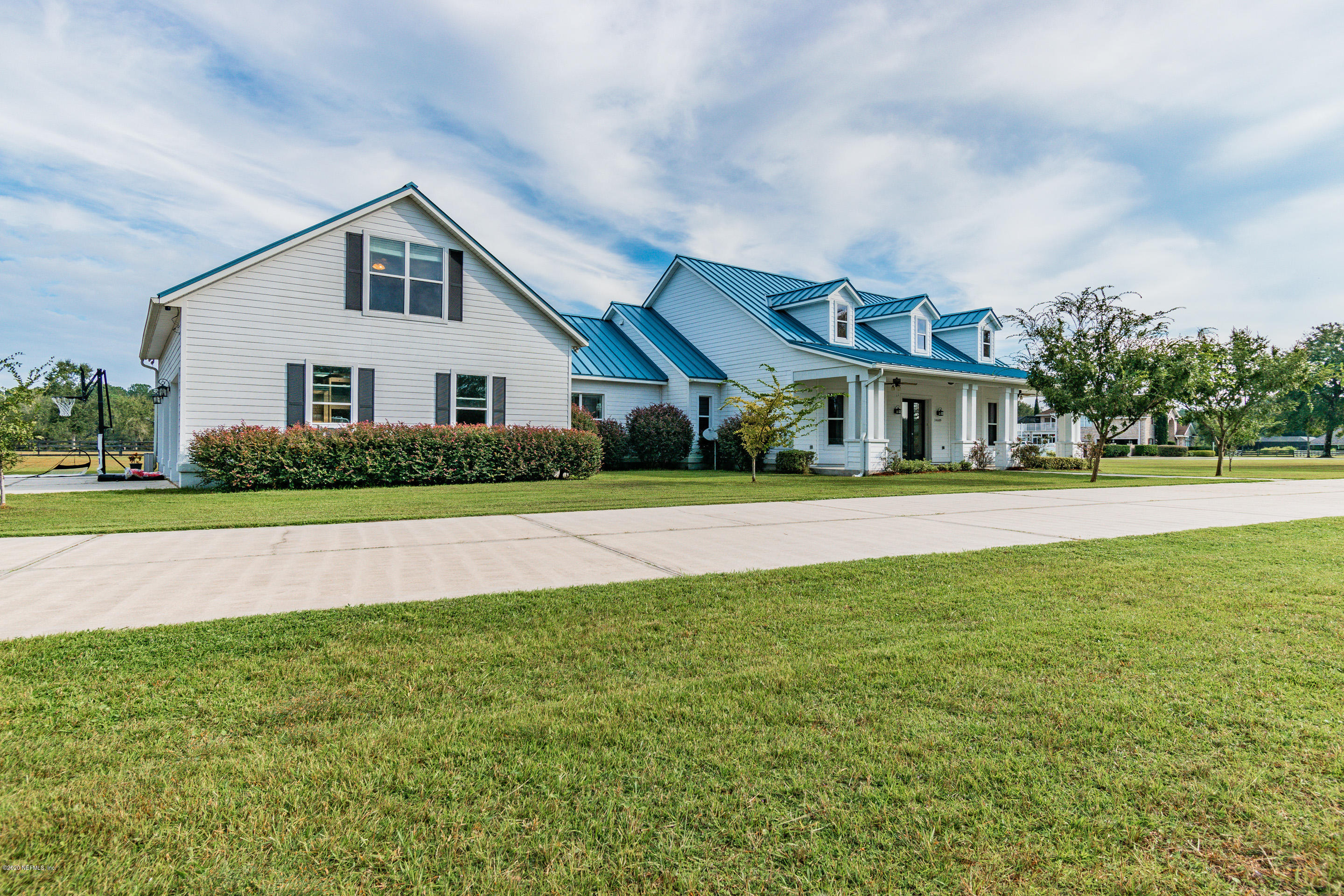 14689 Diamond Ranch Drive Jacksonville, FL 32234 - Photo 2 of 76 a front view of a house with a yard