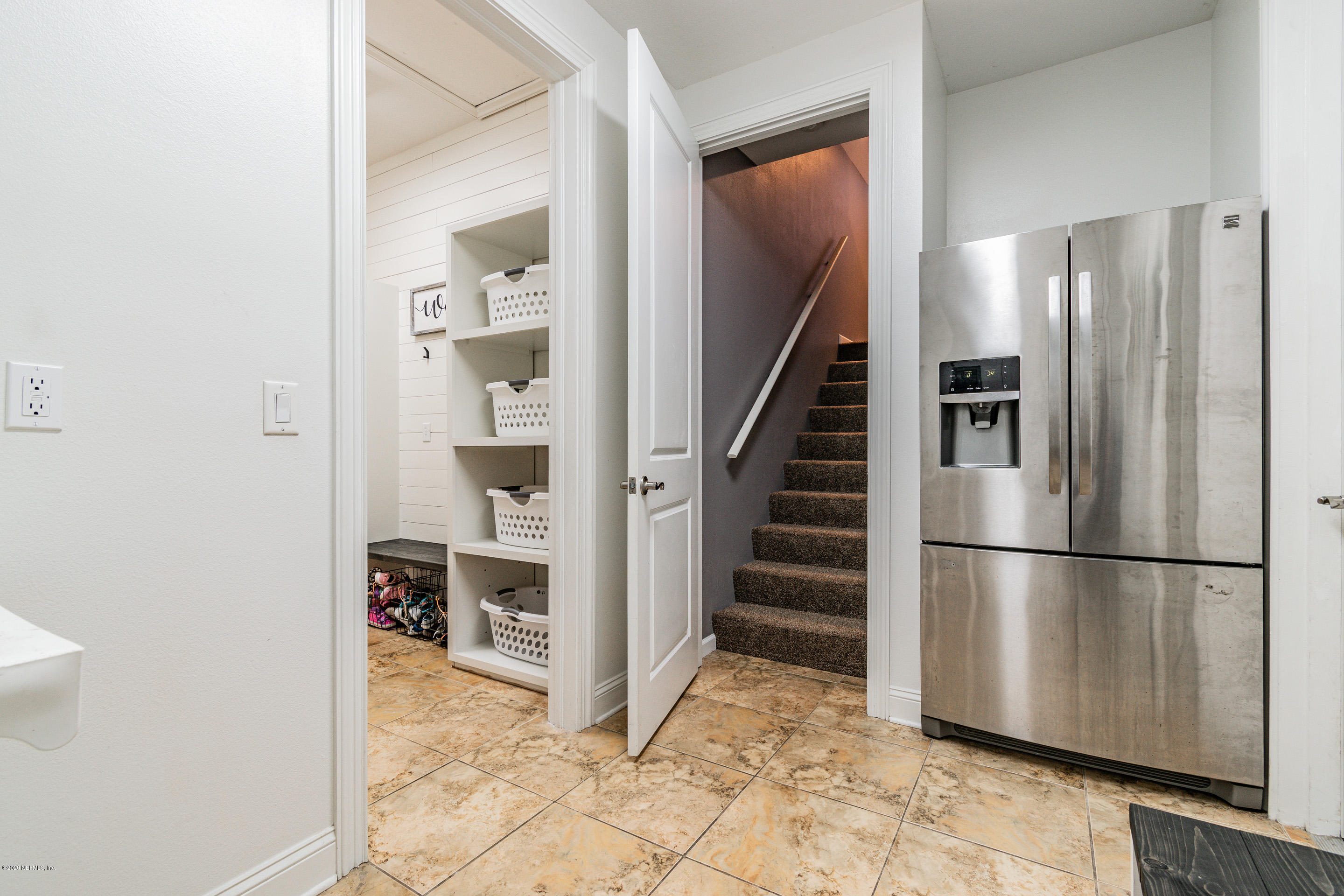 14689 Diamond Ranch Drive Jacksonville, FL 32234 - Photo 21 of 76 a view of a kitchen with wooden floor and electronic appliances