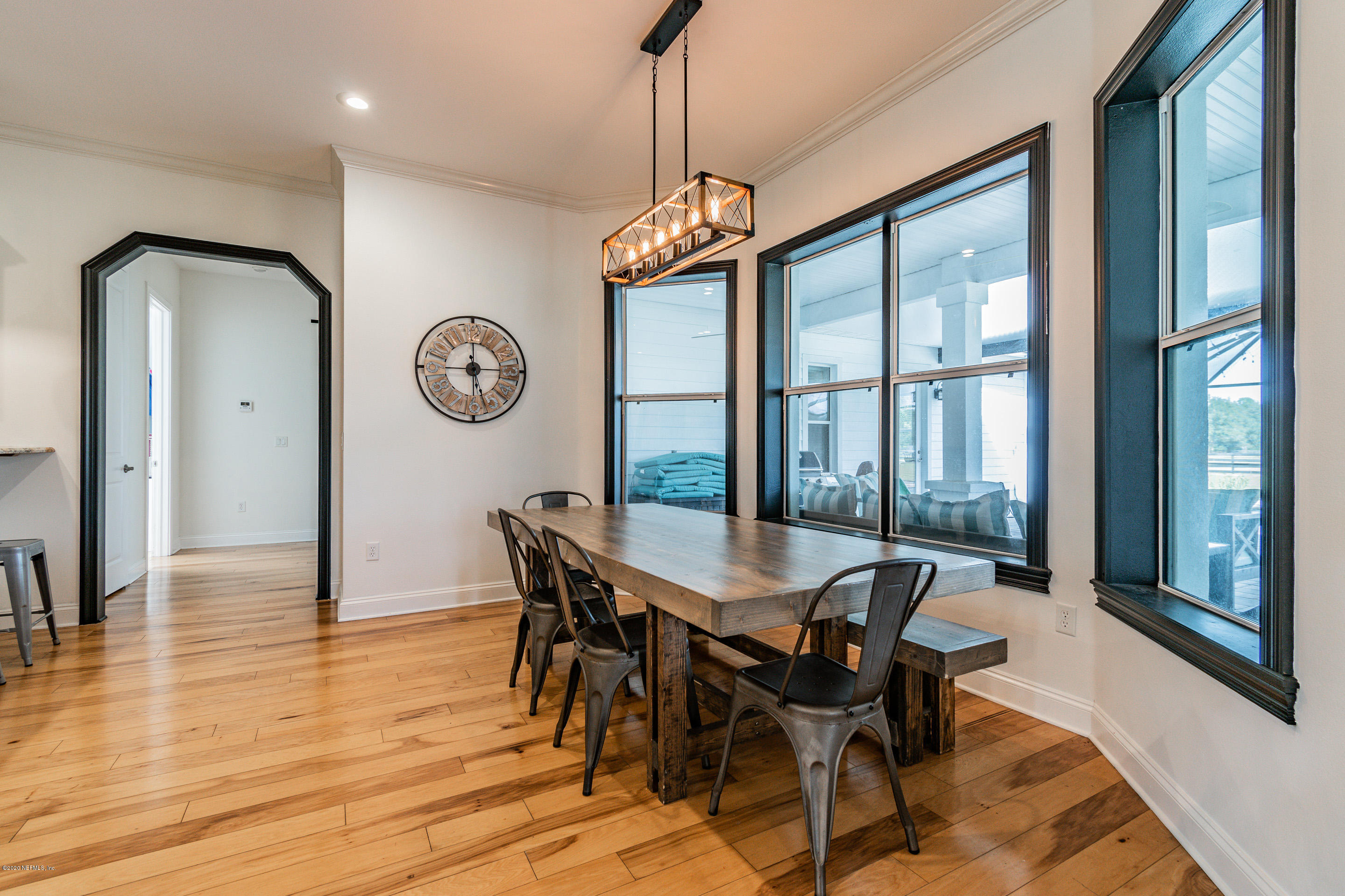 14689 Diamond Ranch Drive Jacksonville, FL 32234 - Photo 24 of 76 a view of a dining room with furniture window and wooden floor