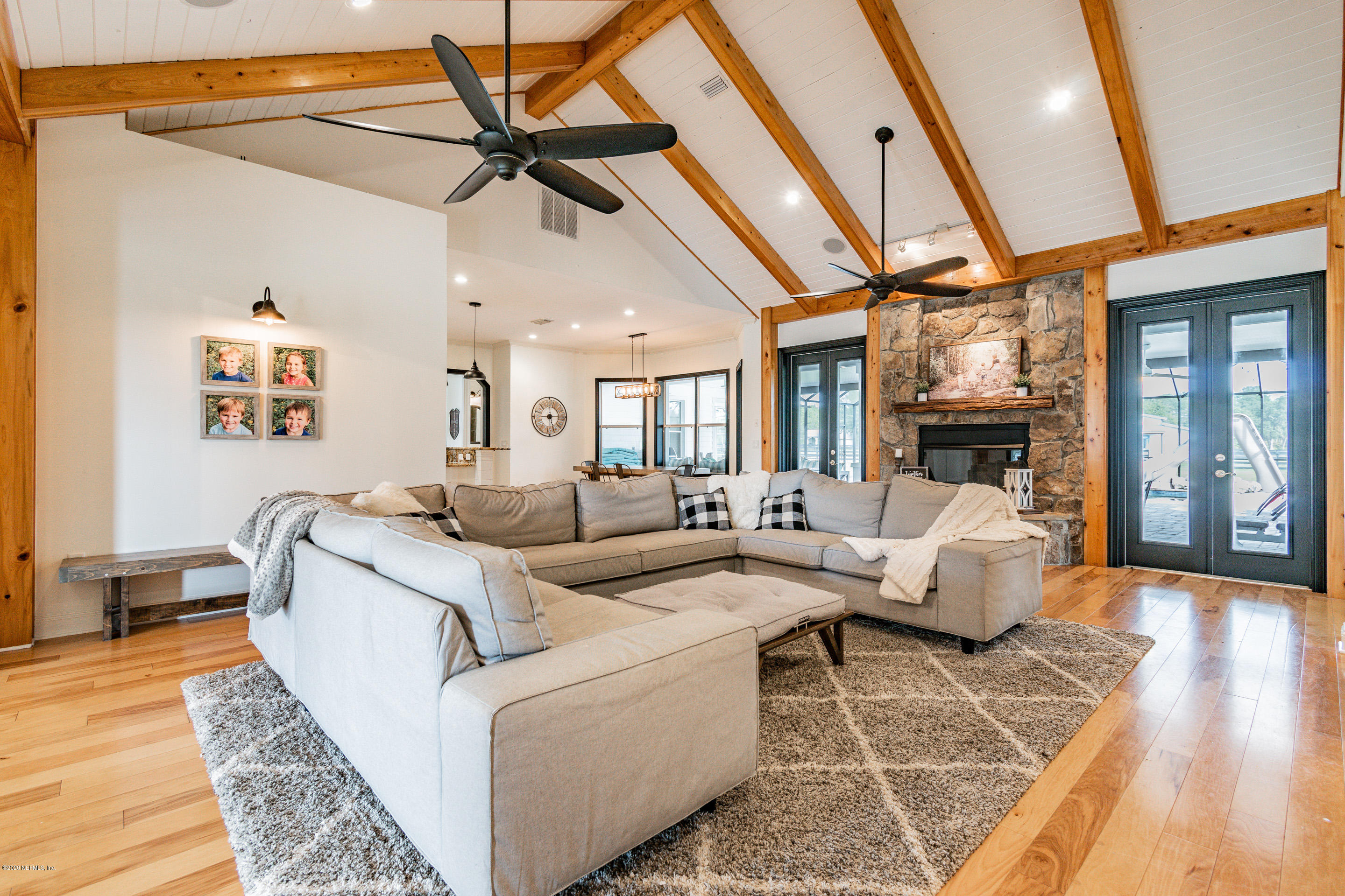 14689 Diamond Ranch Drive Jacksonville, FL 32234 - Photo 26 of 76 a living room with furniture and a fireplace