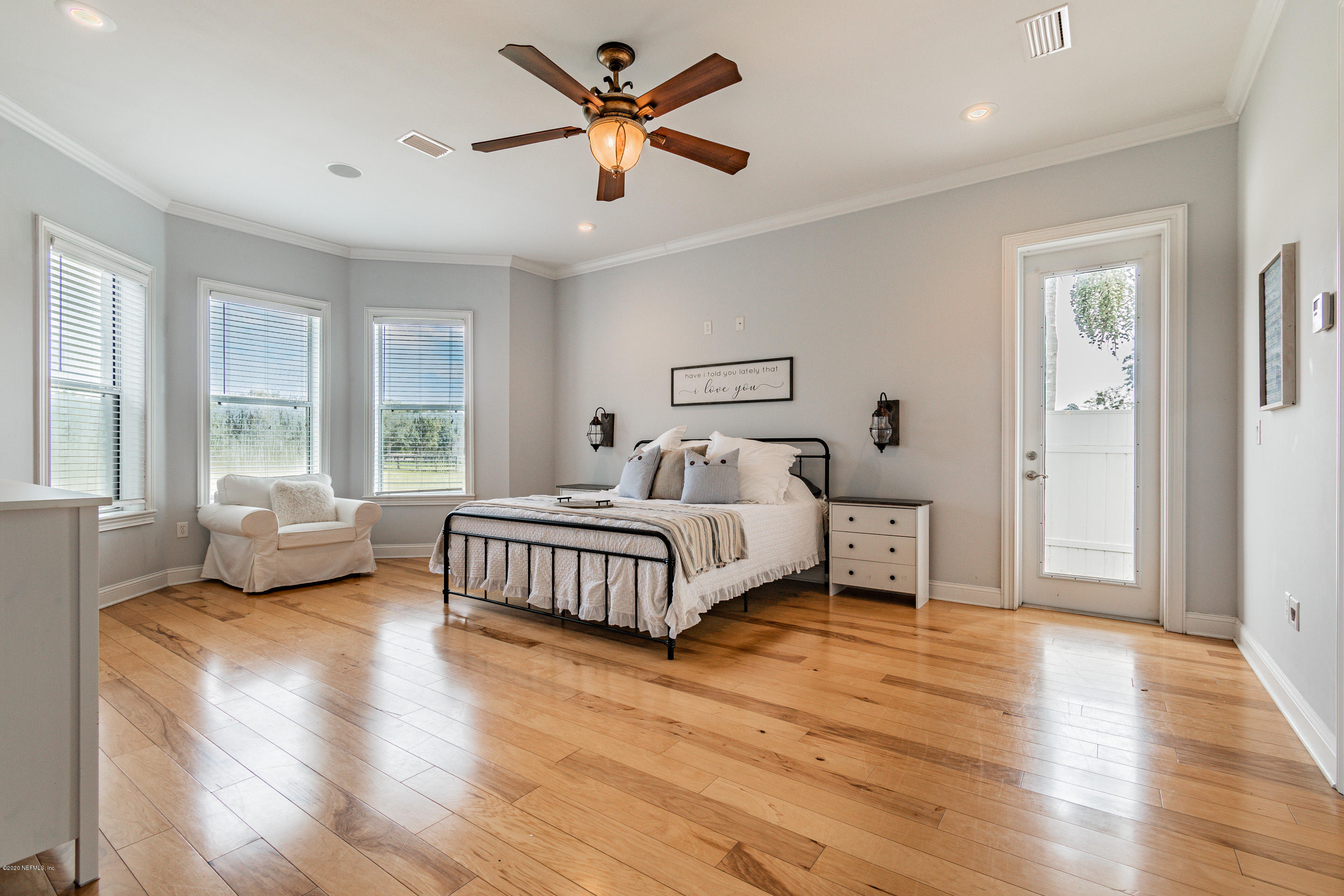 14689 Diamond Ranch Drive Jacksonville, FL 32234 - Photo 29 of 76 a bedroom with a bed couch and a window