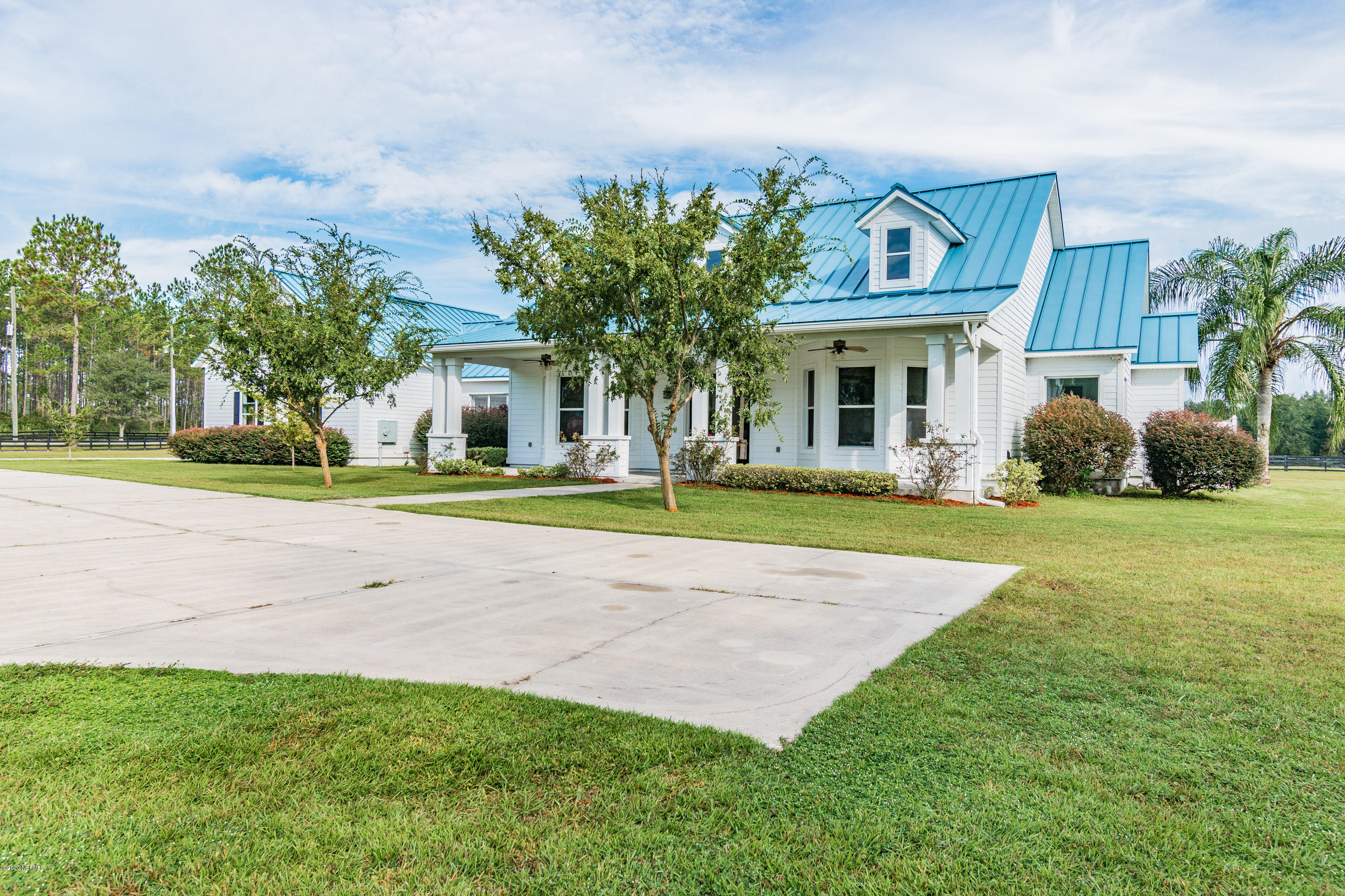14689 Diamond Ranch Drive Jacksonville, FL 32234 - Photo 3 of 76 a front view of a house with garden