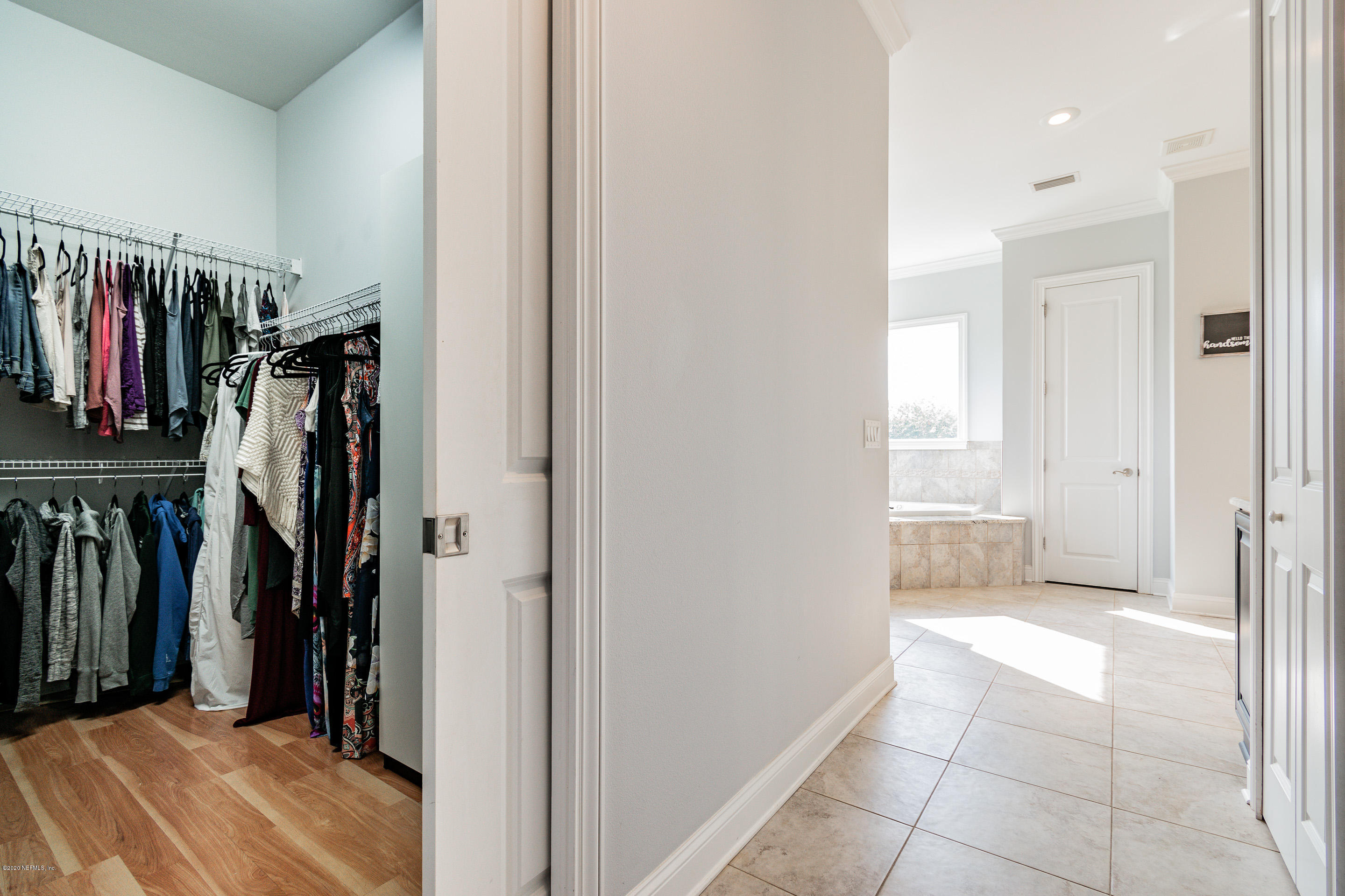 14689 Diamond Ranch Drive Jacksonville, FL 32234 - Photo 32 of 76 a view of walk in closet with clothes and shoes