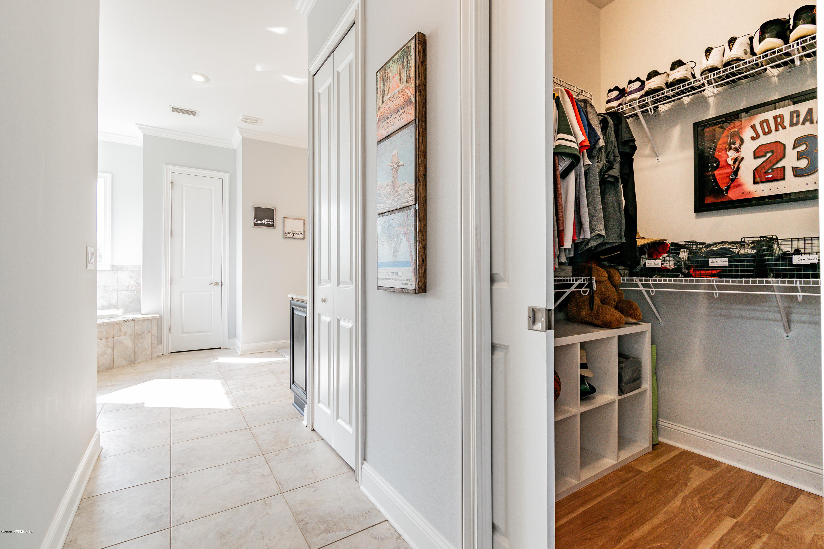 14689 Diamond Ranch Drive Jacksonville, FL 32234 - Photo 33 of 76 a view of a storage and utility room with two washing machine