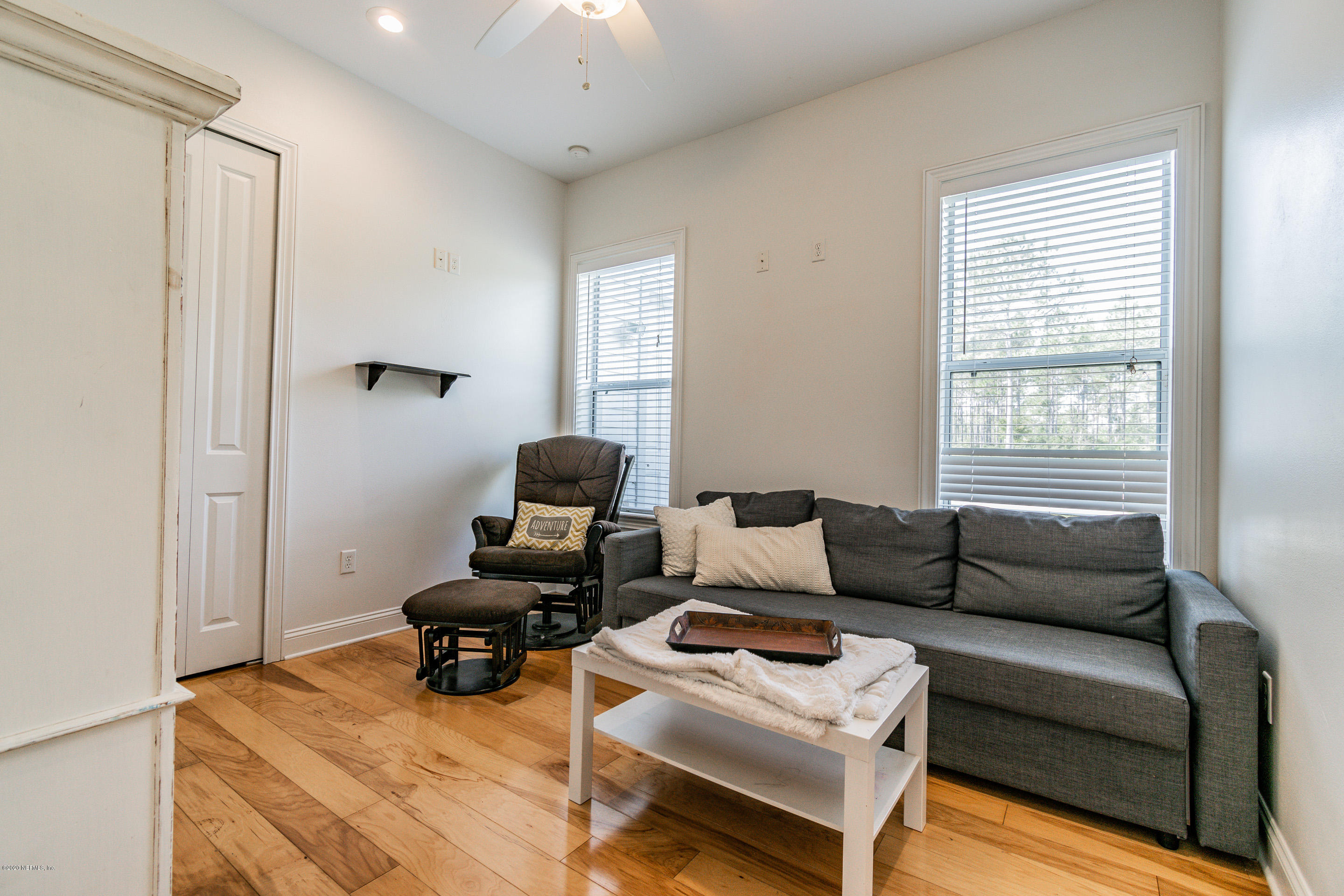14689 Diamond Ranch Drive Jacksonville, FL 32234 - Photo 43 of 76 a living room with furniture and a window