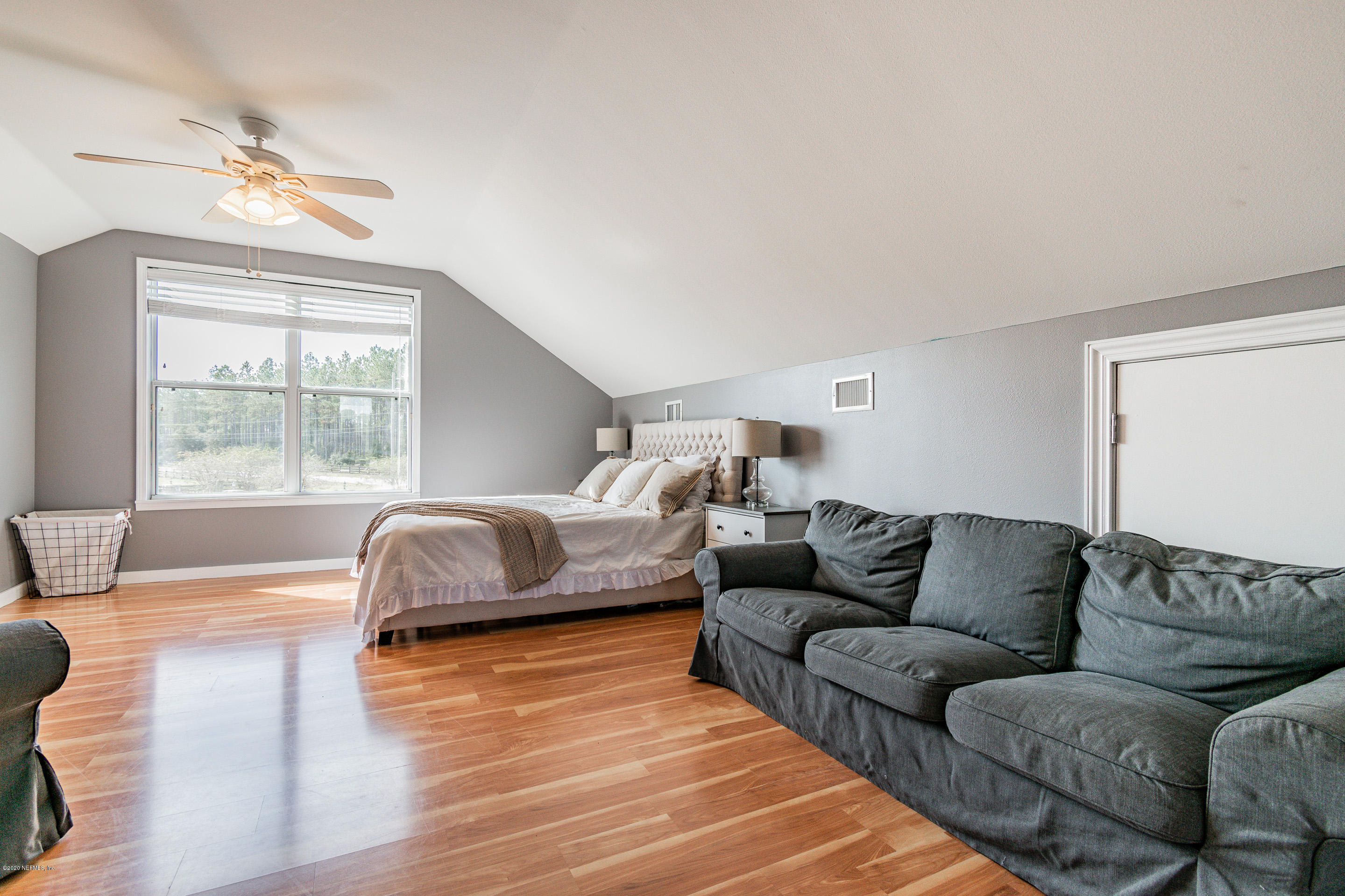 14689 Diamond Ranch Drive Jacksonville, FL 32234 - Photo 49 of 76 a living room with furniture and a large window