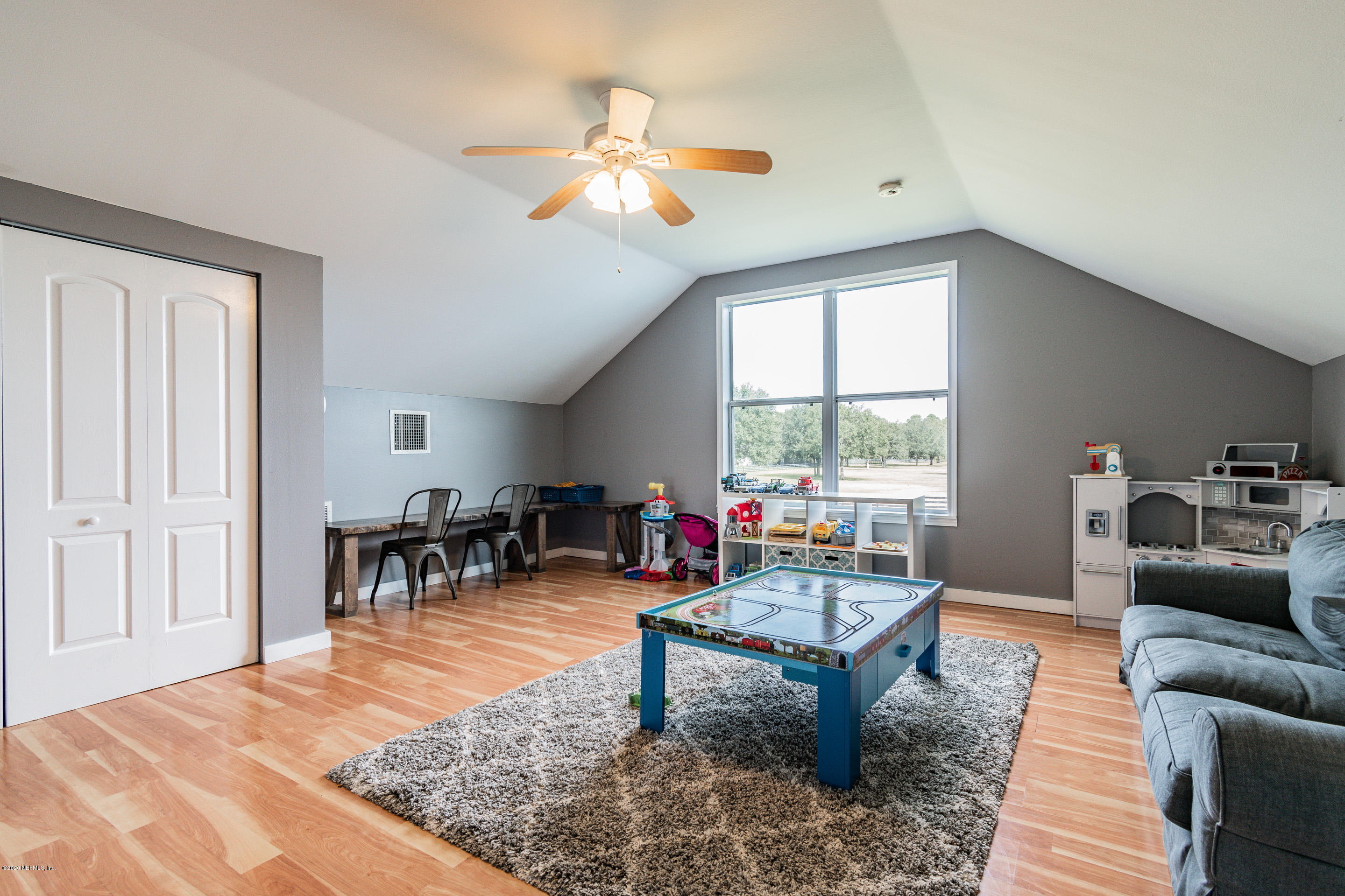 14689 Diamond Ranch Drive Jacksonville, FL 32234 - Photo 53 of 76 a living room with furniture and a large window