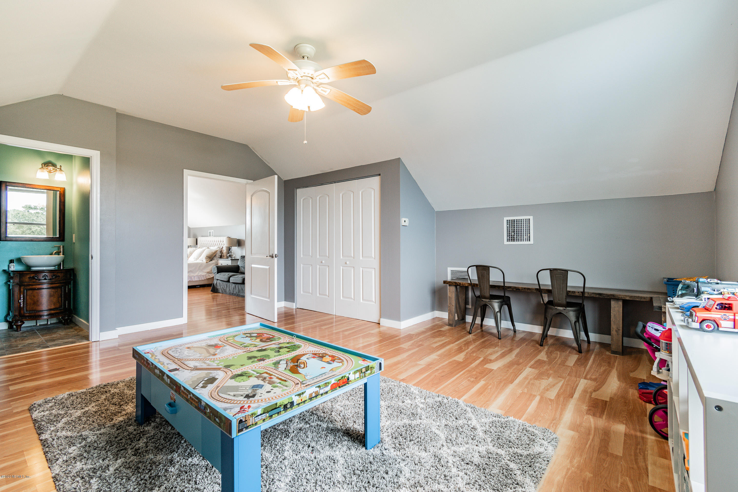 14689 Diamond Ranch Drive Jacksonville, FL 32234 - Photo 54 of 76 a living room with furniture a dining table and a rug