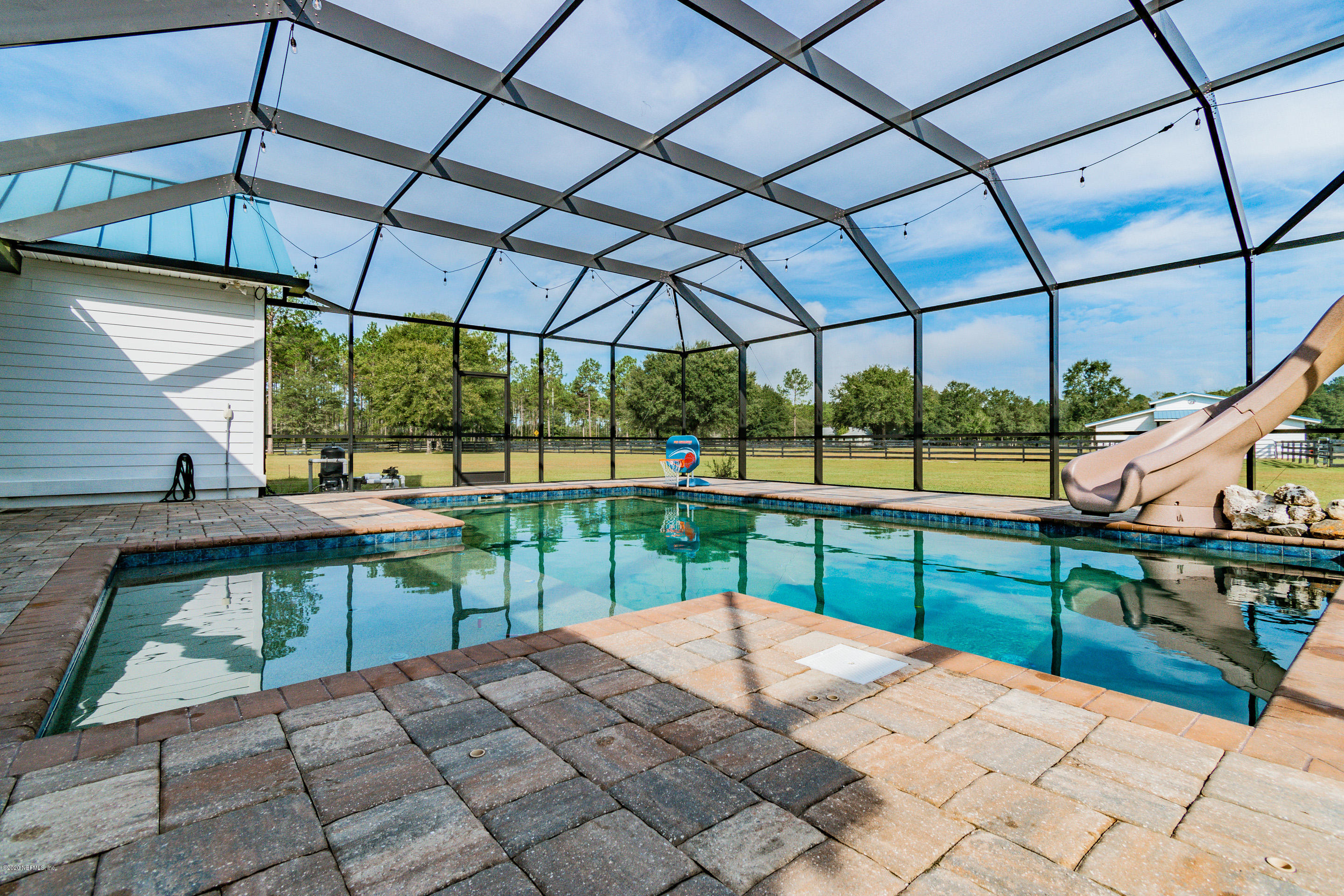14689 Diamond Ranch Drive Jacksonville, FL 32234 - Photo 61 of 76 a view of a backyard with sitting area