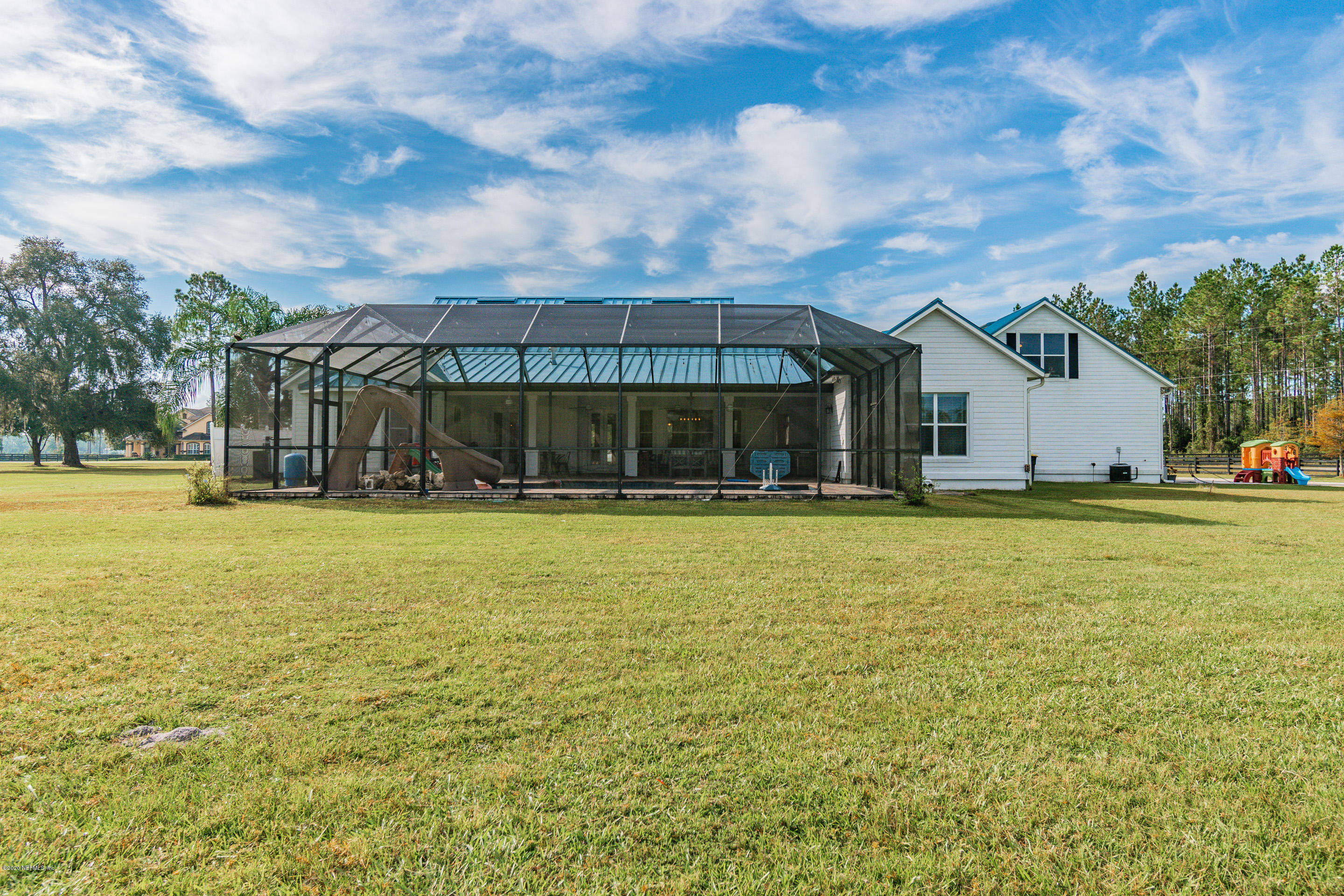 14689 Diamond Ranch Drive Jacksonville, FL 32234 - Photo 66 of 76 a view of swimming pool is middle in front of house