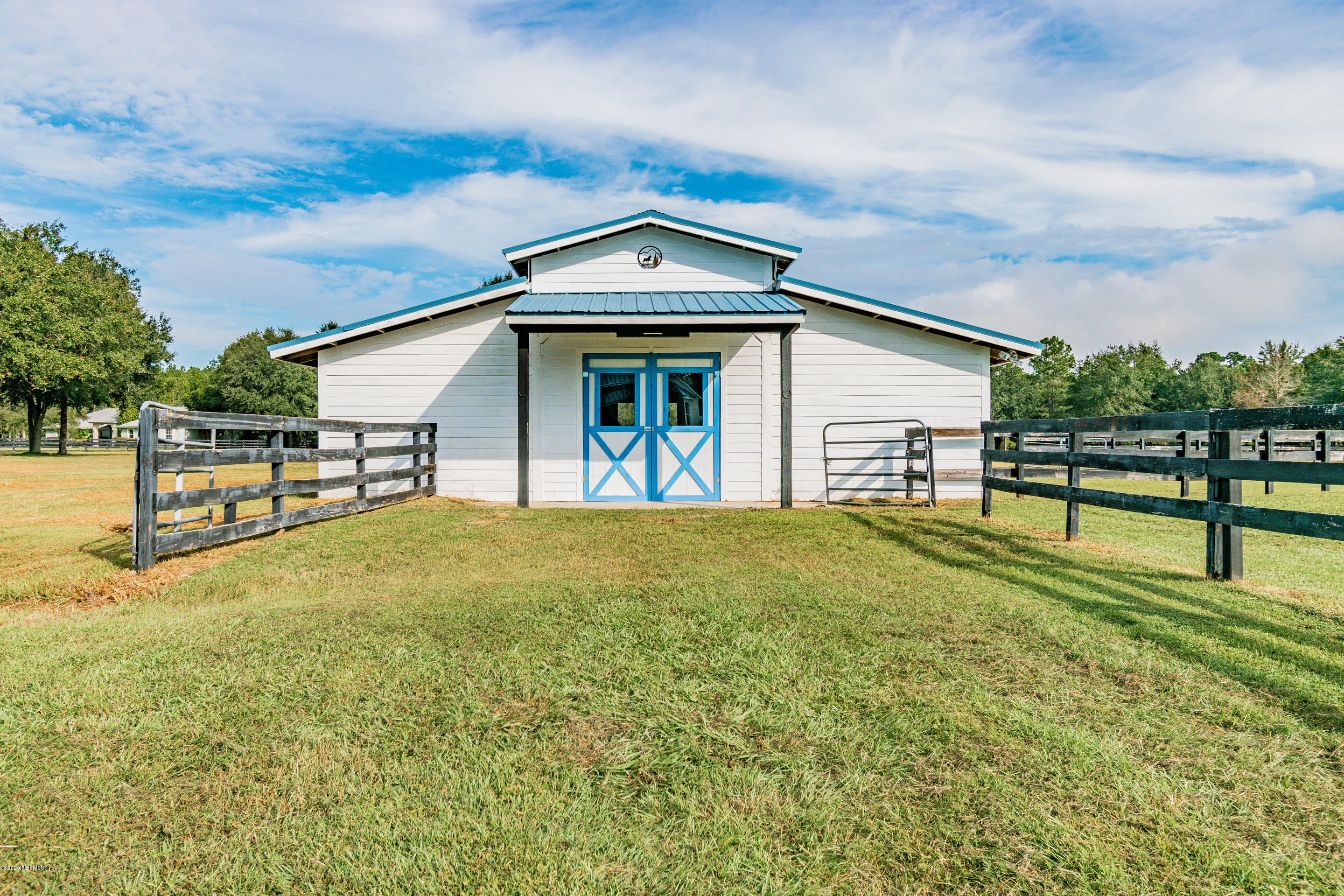 14689 Diamond Ranch Drive Jacksonville, FL 32234 - Photo 67 of 76 a view of a house with a yard and a garden
