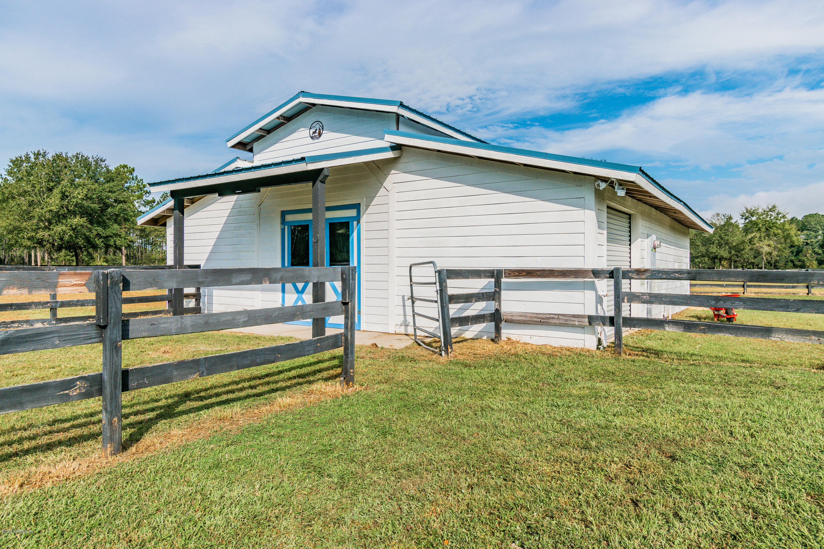 14689 Diamond Ranch Drive Jacksonville, FL 32234 - Photo 69 of 76 a view of a house with a yard and sitting area