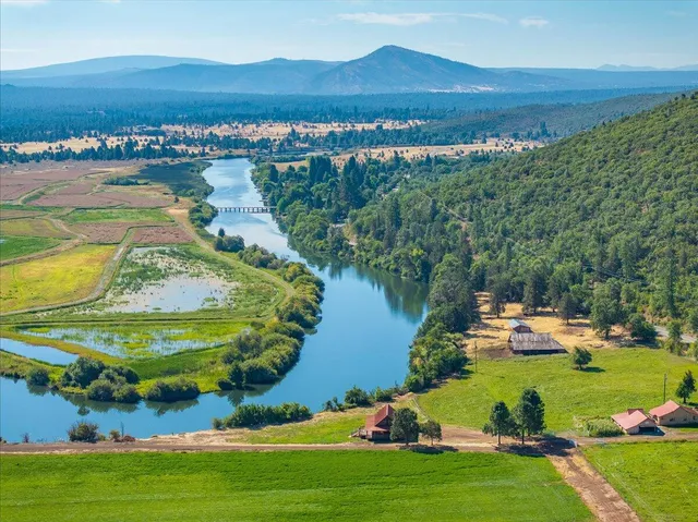 a view of a livingroom with furniture and staircase